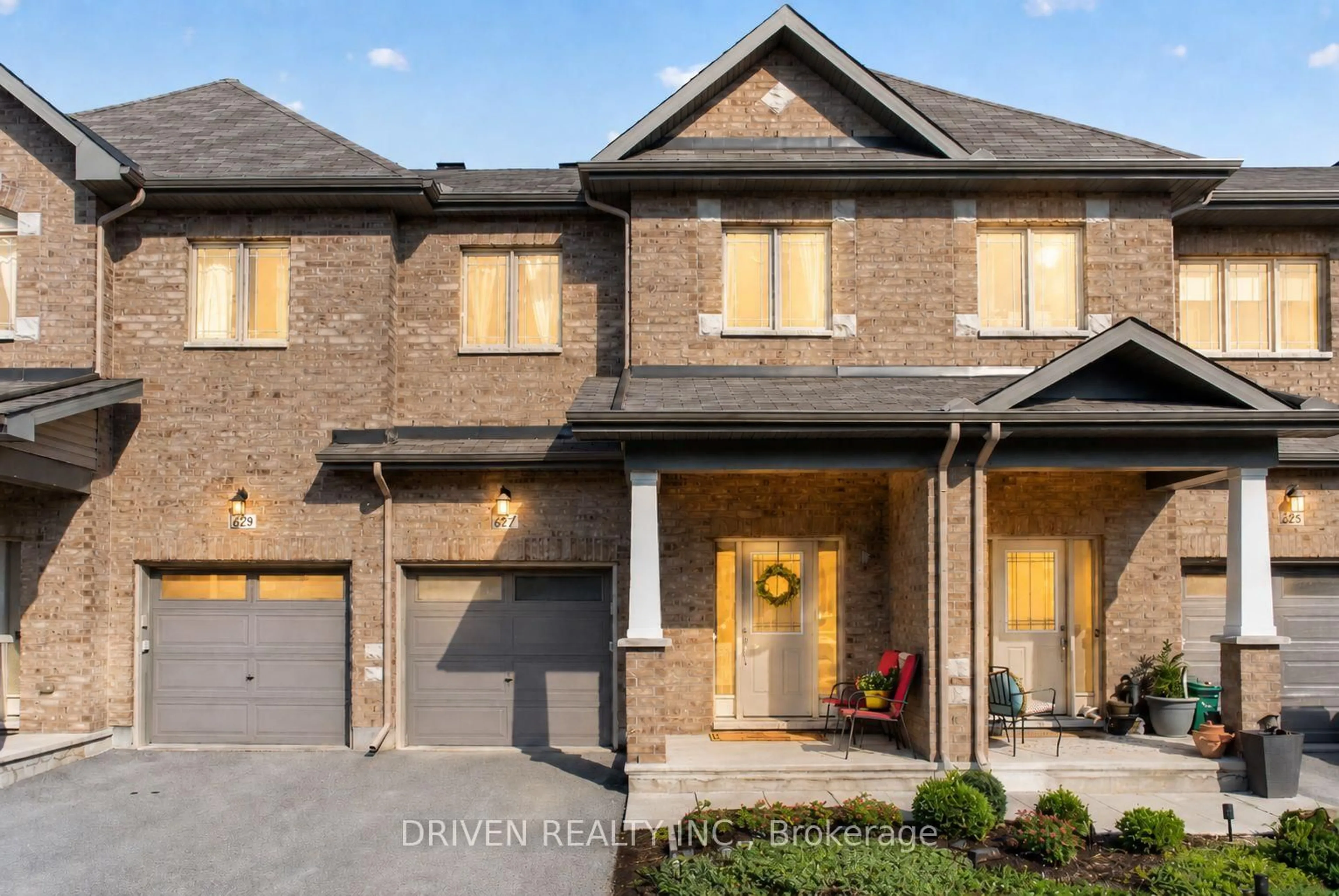 Home with brick exterior material, street for 627 Via Campanale Ave, Ottawa Ontario K2J 4A2