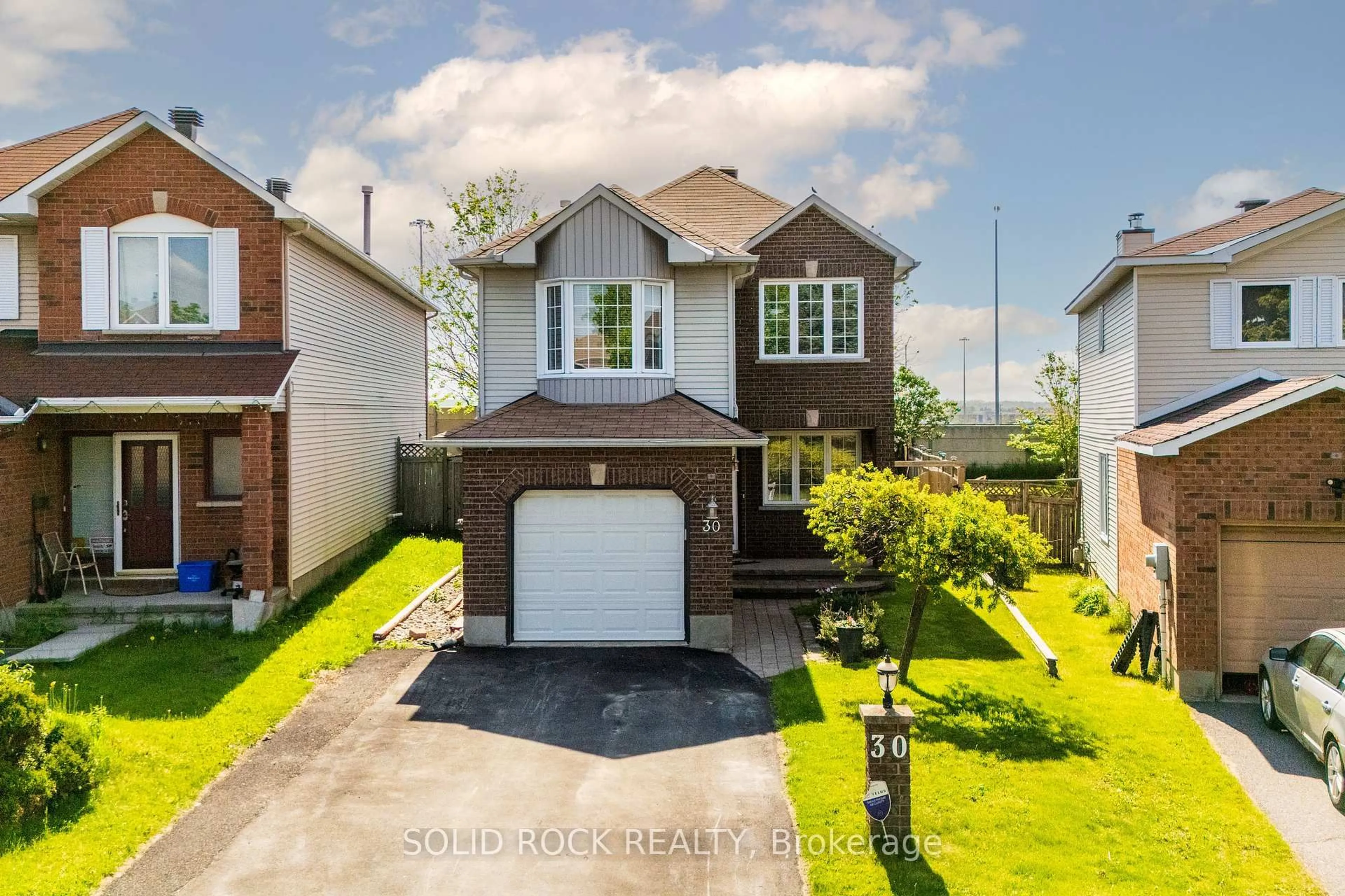 A pic from outside/outdoor area/front of a property/back of a property/a pic from drone, street for 30 Rowe Dr, Kanata Ontario K2L 3Y3
