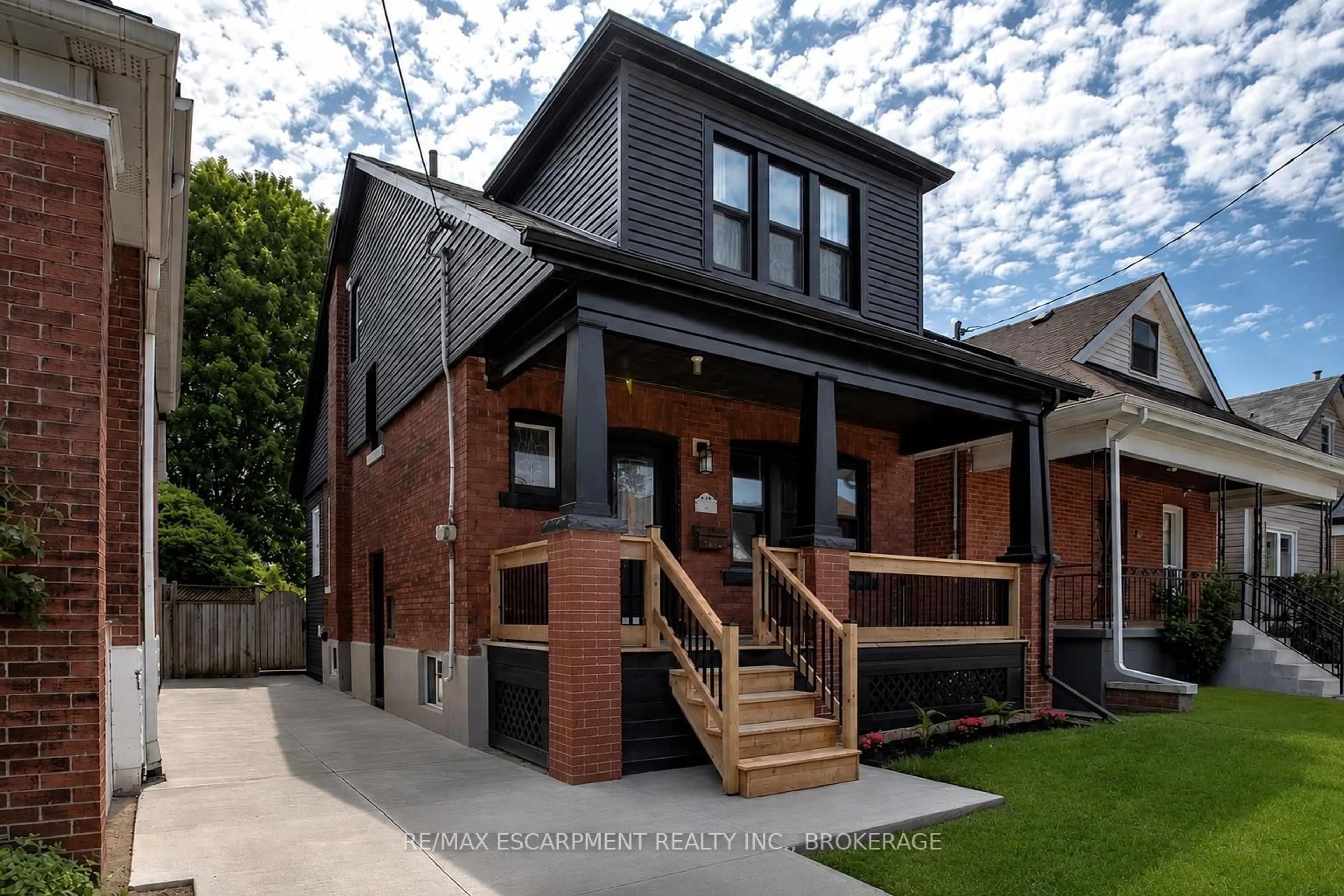 Home with brick exterior material, street for 106 Grosvenor Ave, Hamilton Ontario L8L 7S6