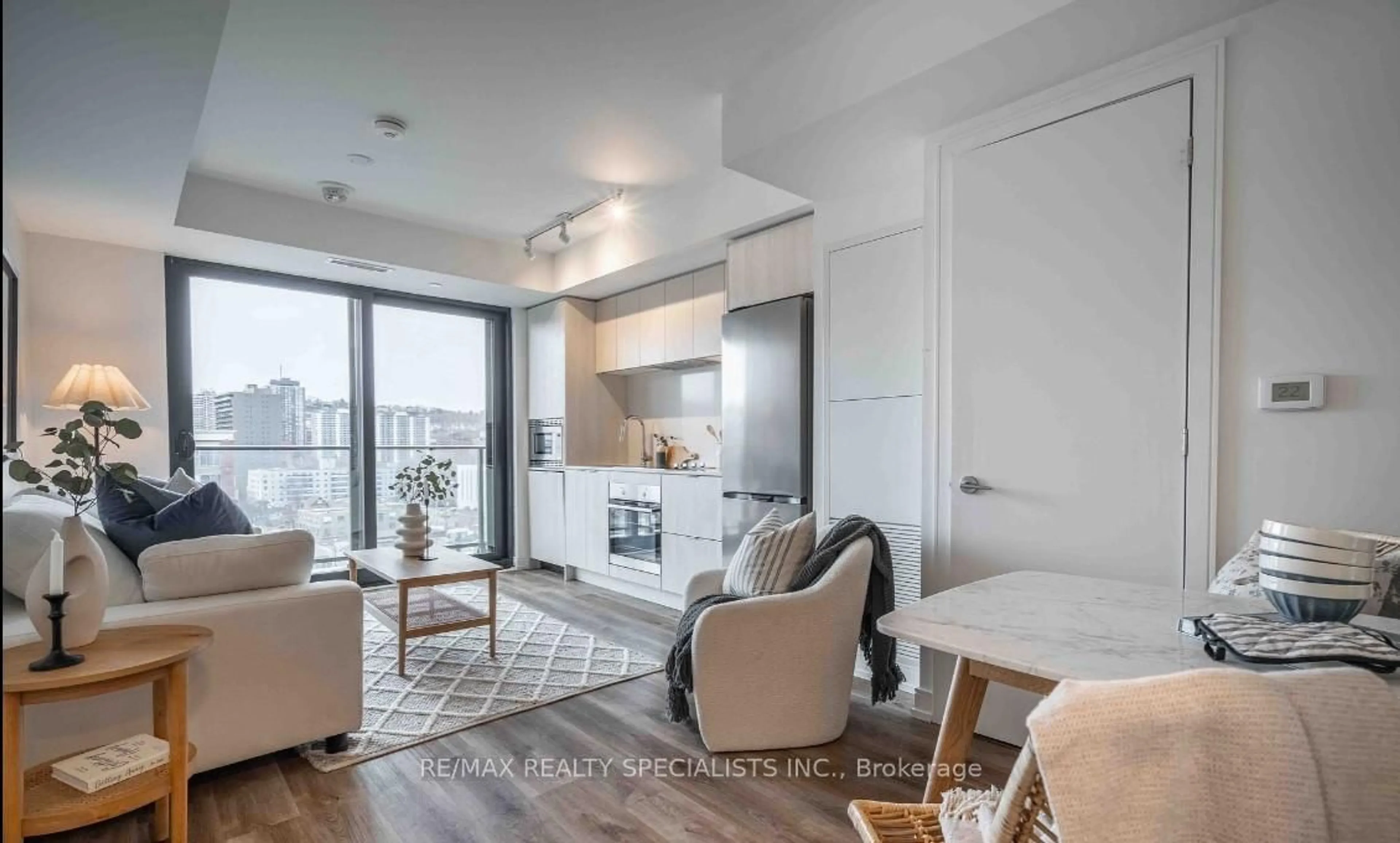 Living room with furniture, wood/laminate floor for 1 Jarvis St #1206, Hamilton Ontario L8R 3J2