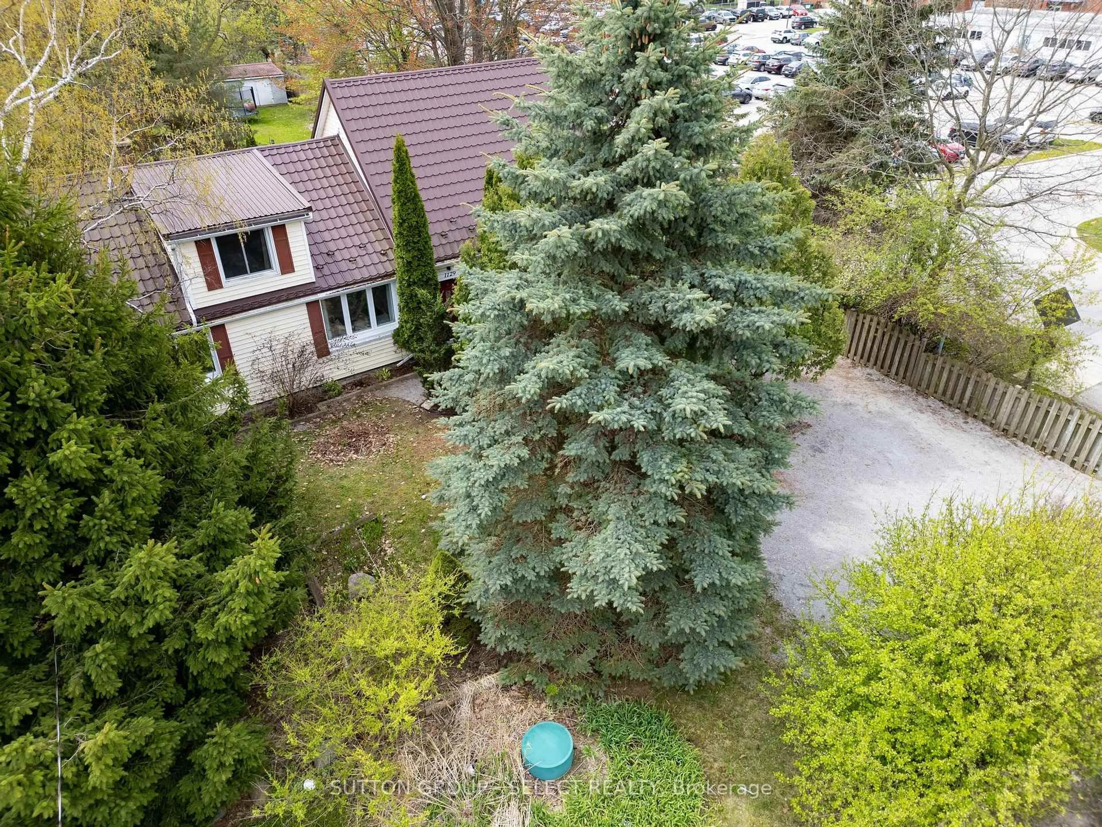A pic from outside/outdoor area/front of a property/back of a property/a pic from drone, forest/trees view for 1129 Sunningdale Rd, London North Ontario N5X 4B1