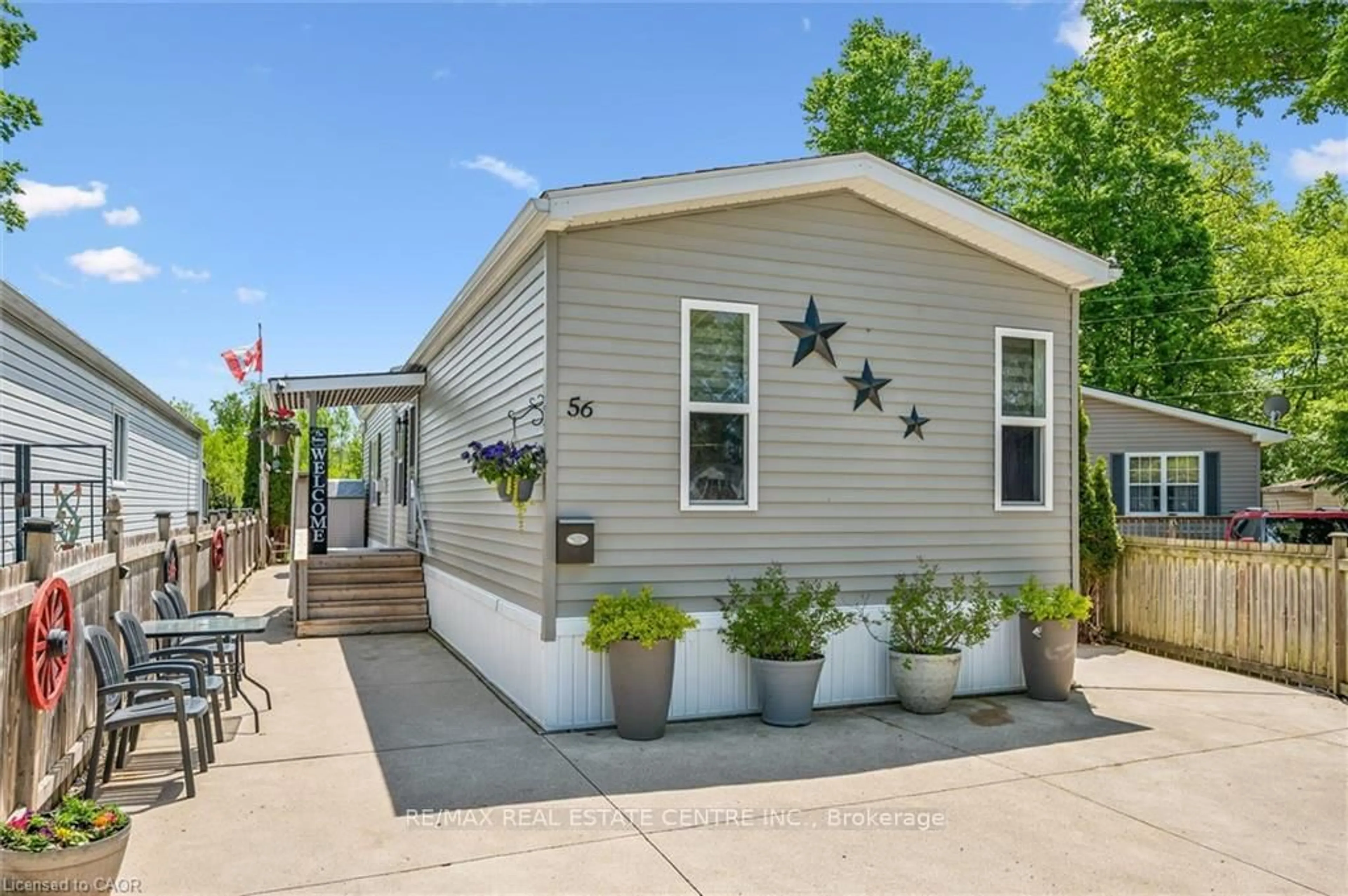 Home with vinyl exterior material, street for 56 Ash Ave, Puslinch Ontario N0B 2J0