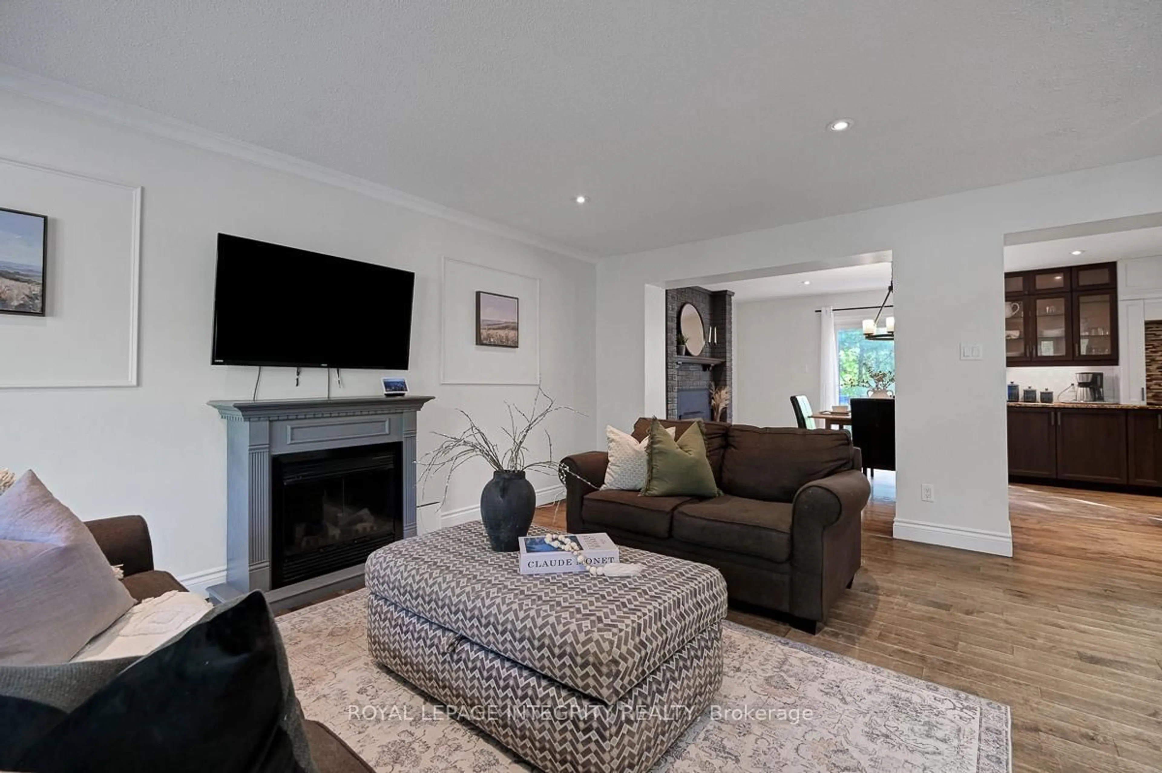 Living room with furniture, wood/laminate floor for 2414 Mcgee Side Rd, Carp Ontario K0A 1L0