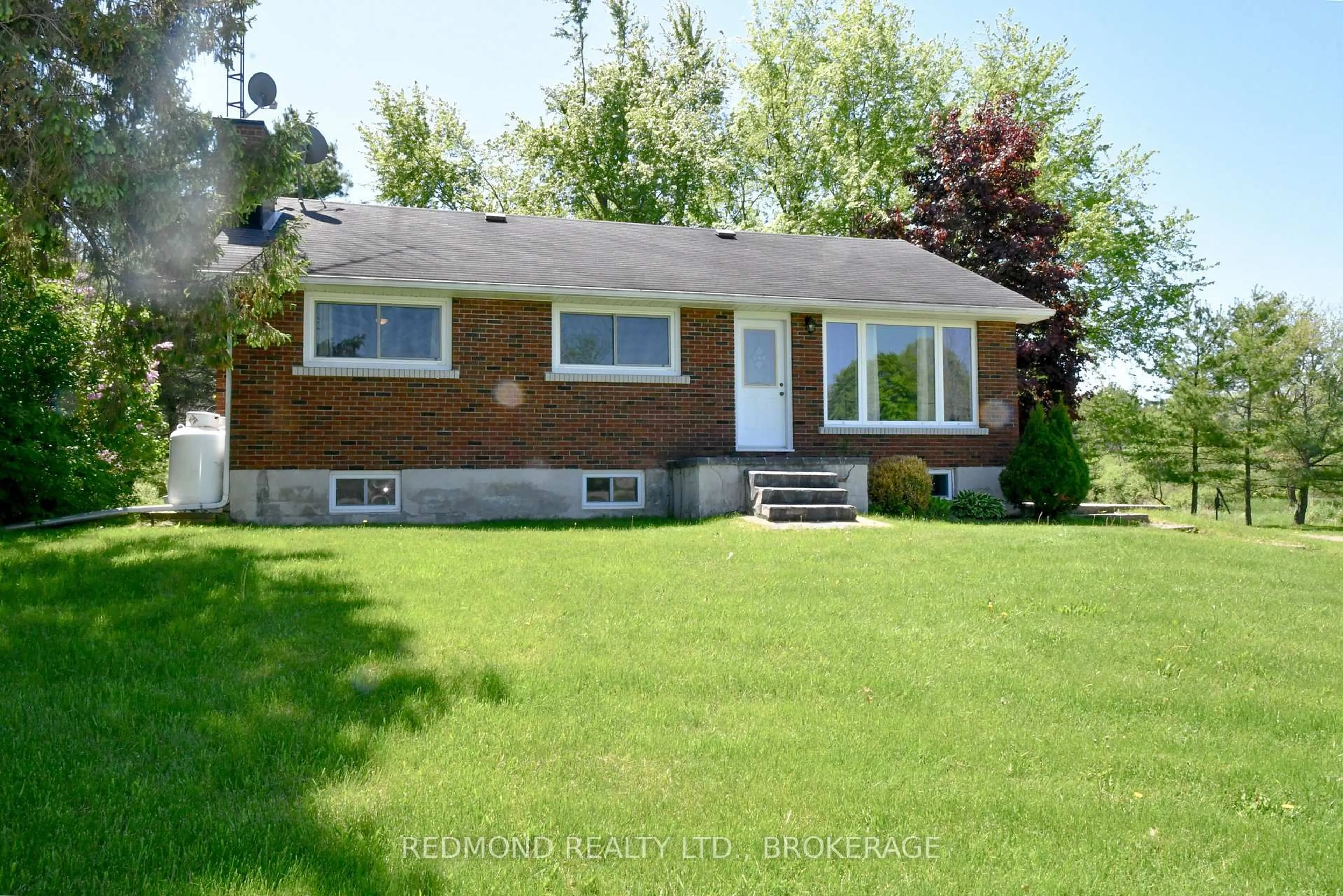 Home with brick exterior material, street for 513 County 2 Rd, Front of Leeds & Seeleys Bay Ontario K7G 2V4
