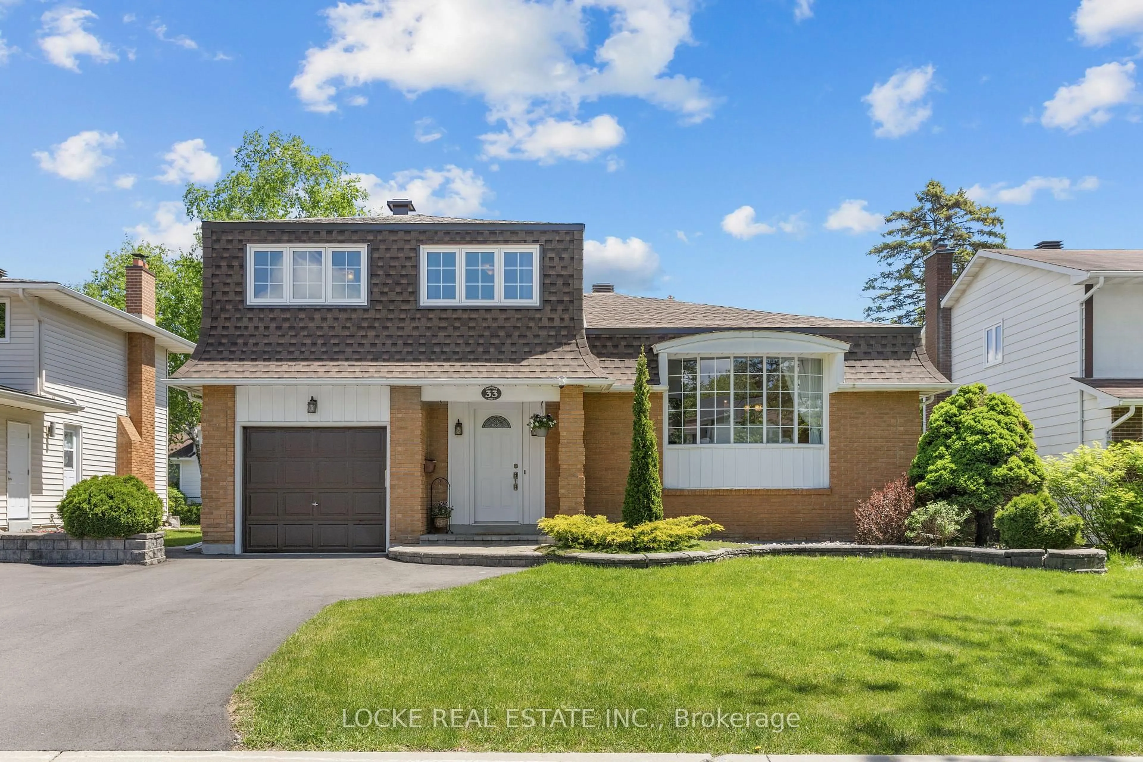 Home with brick exterior material, street for 33 Eastpark Dr, Ottawa Ontario K1B 3Z6