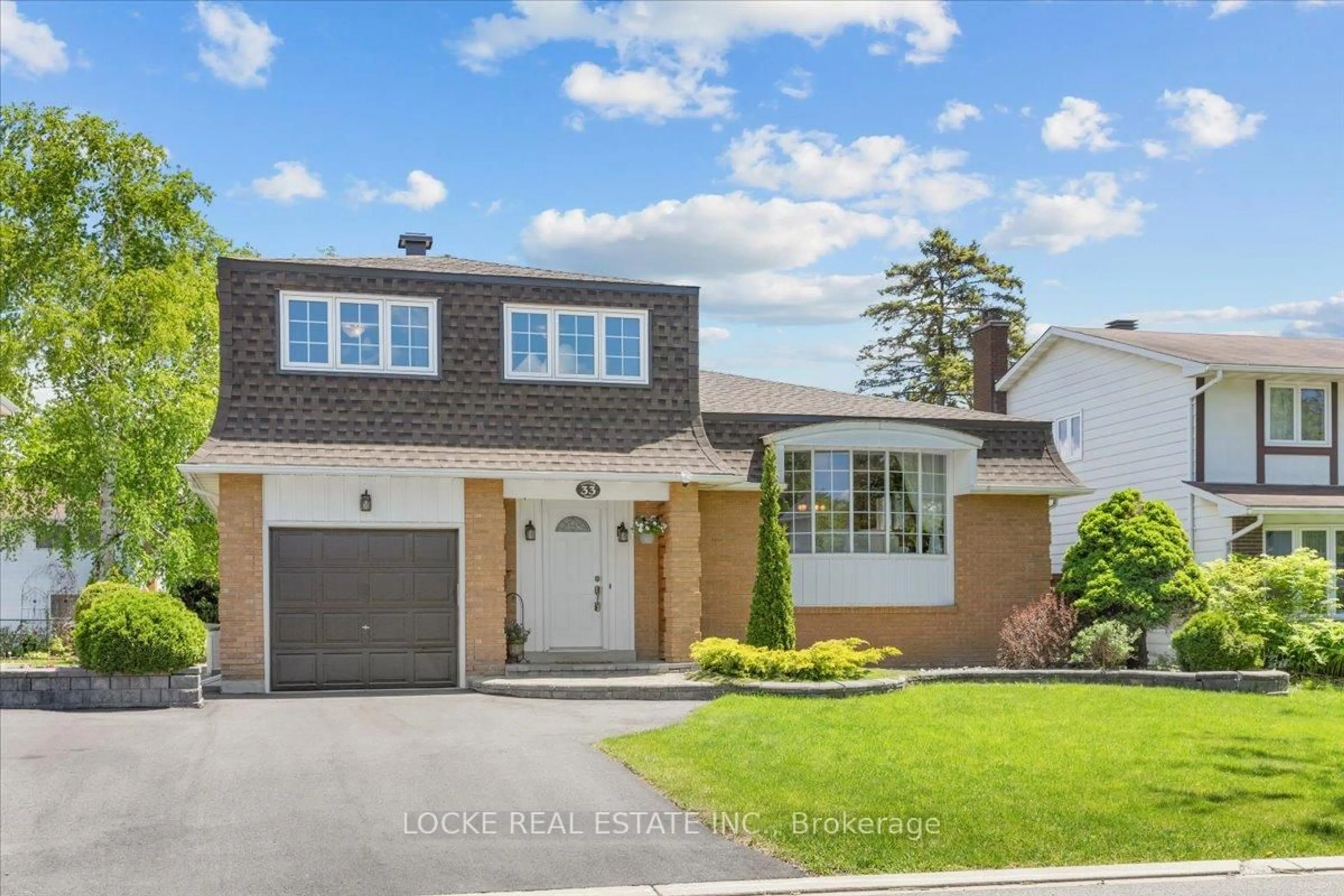 Home with brick exterior material, street for 33 Eastpark Dr, Ottawa Ontario K1B 3Z6