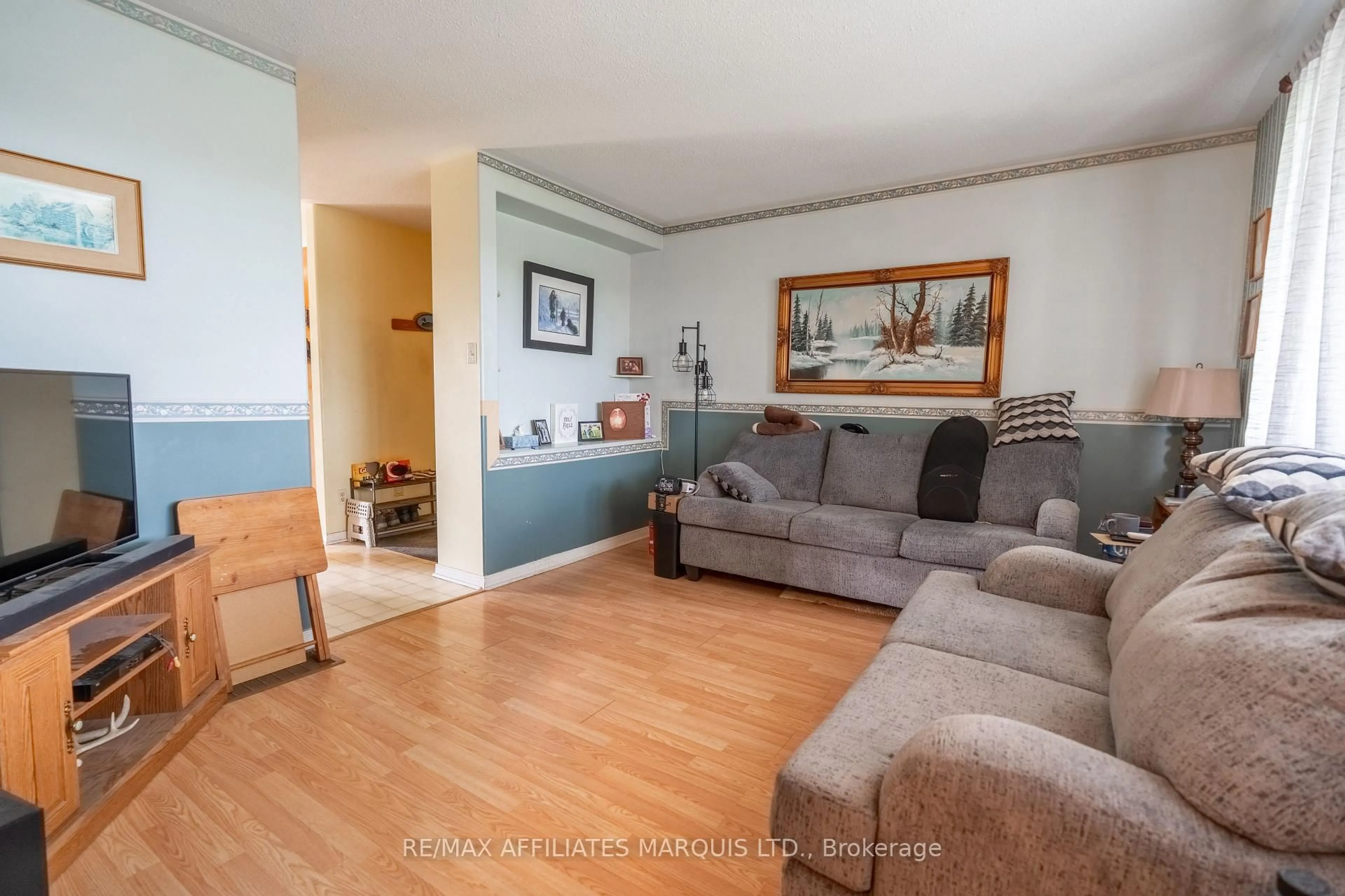 Living room with furniture, wood/laminate floor for 12889 River Rd, North Dundas Ontario K0C 1H0