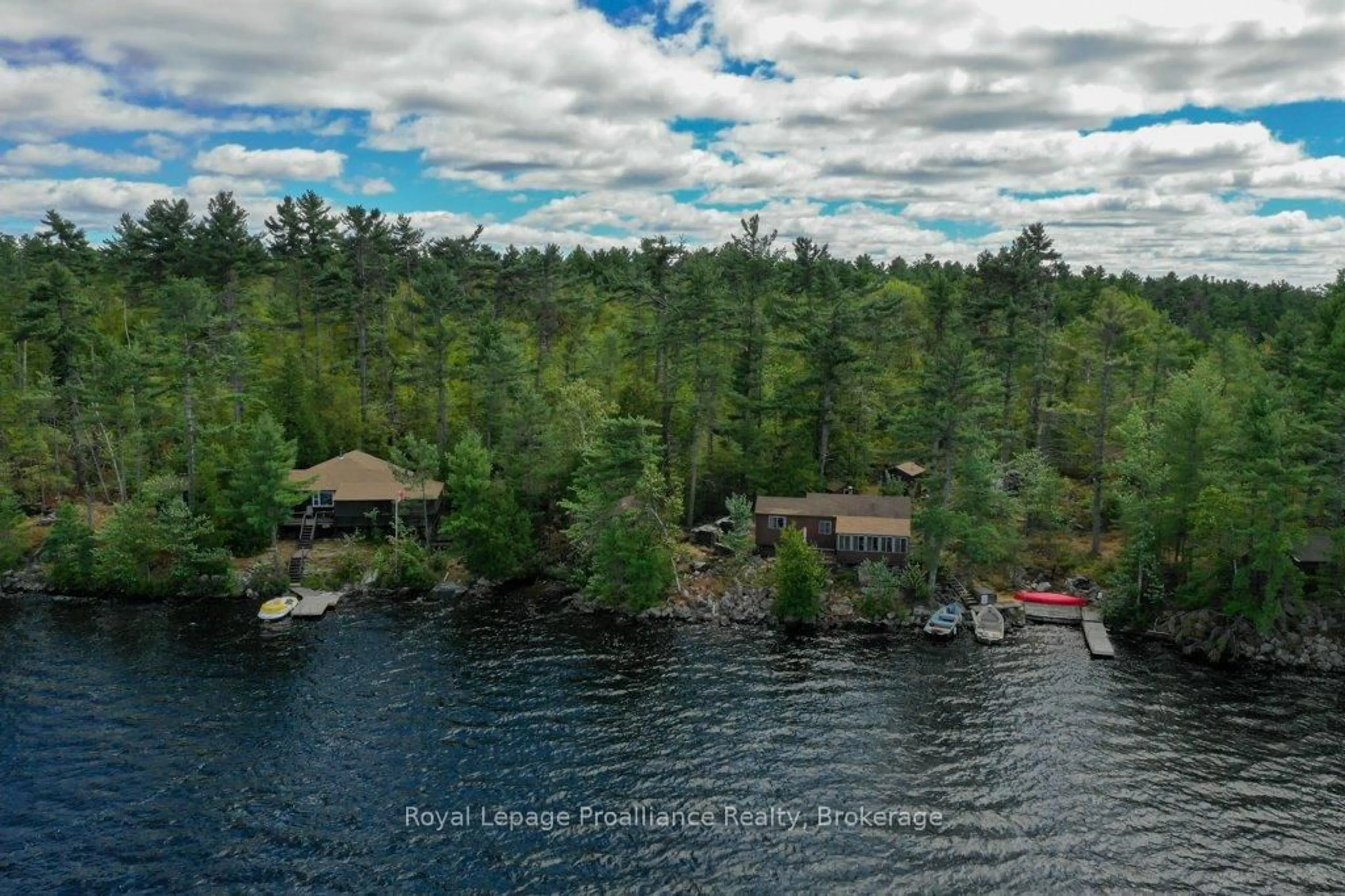 A pic from outside/outdoor area/front of a property/back of a property/a pic from drone, water/lake/river/ocean view for 258 Skootamatta Lake, Cloyne Ontario K0H 1K0
