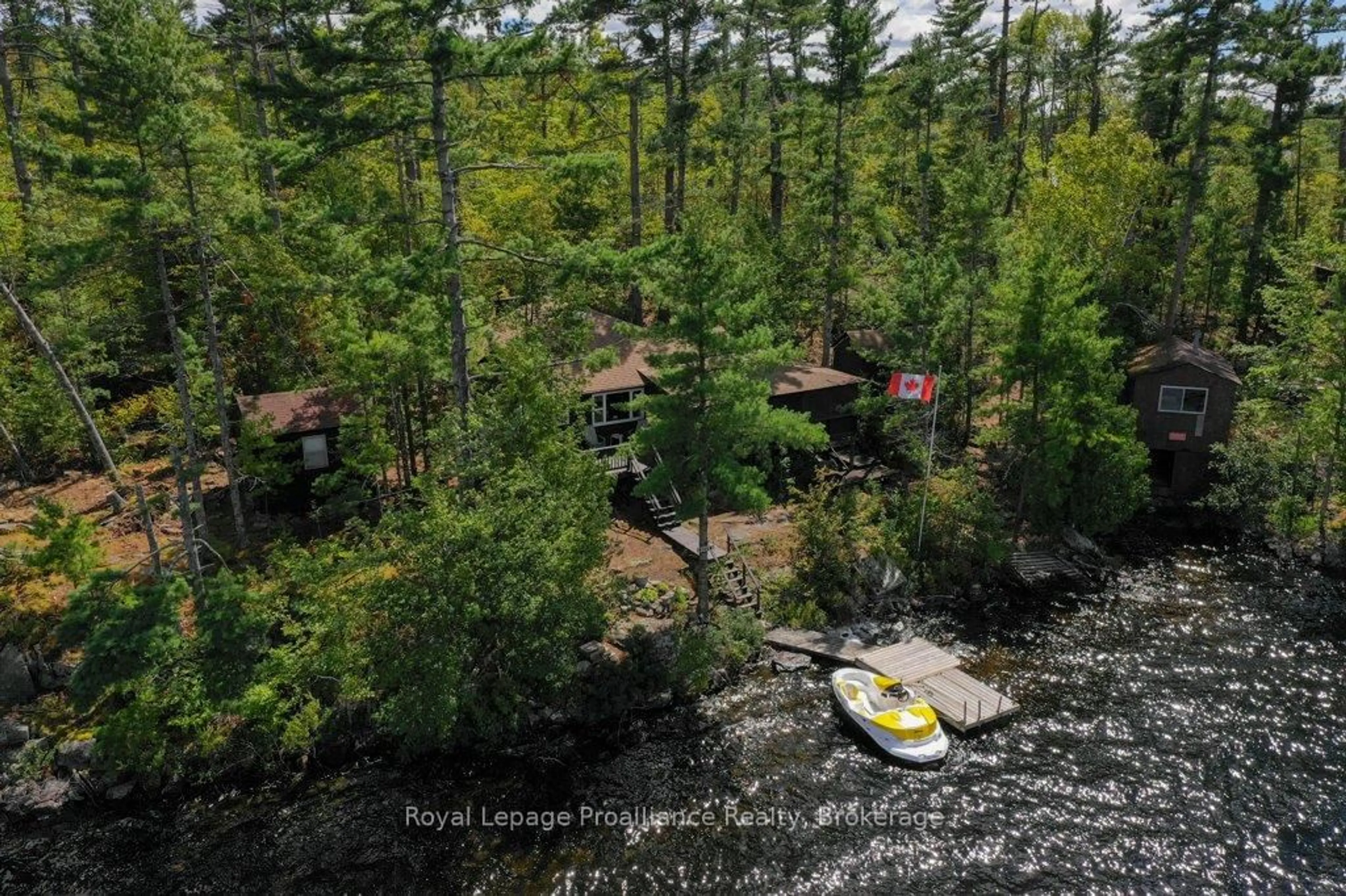 A pic from outside/outdoor area/front of a property/back of a property/a pic from drone, water/lake/river/ocean view for 258 Skootamatta Lake, Cloyne Ontario K0H 1K0