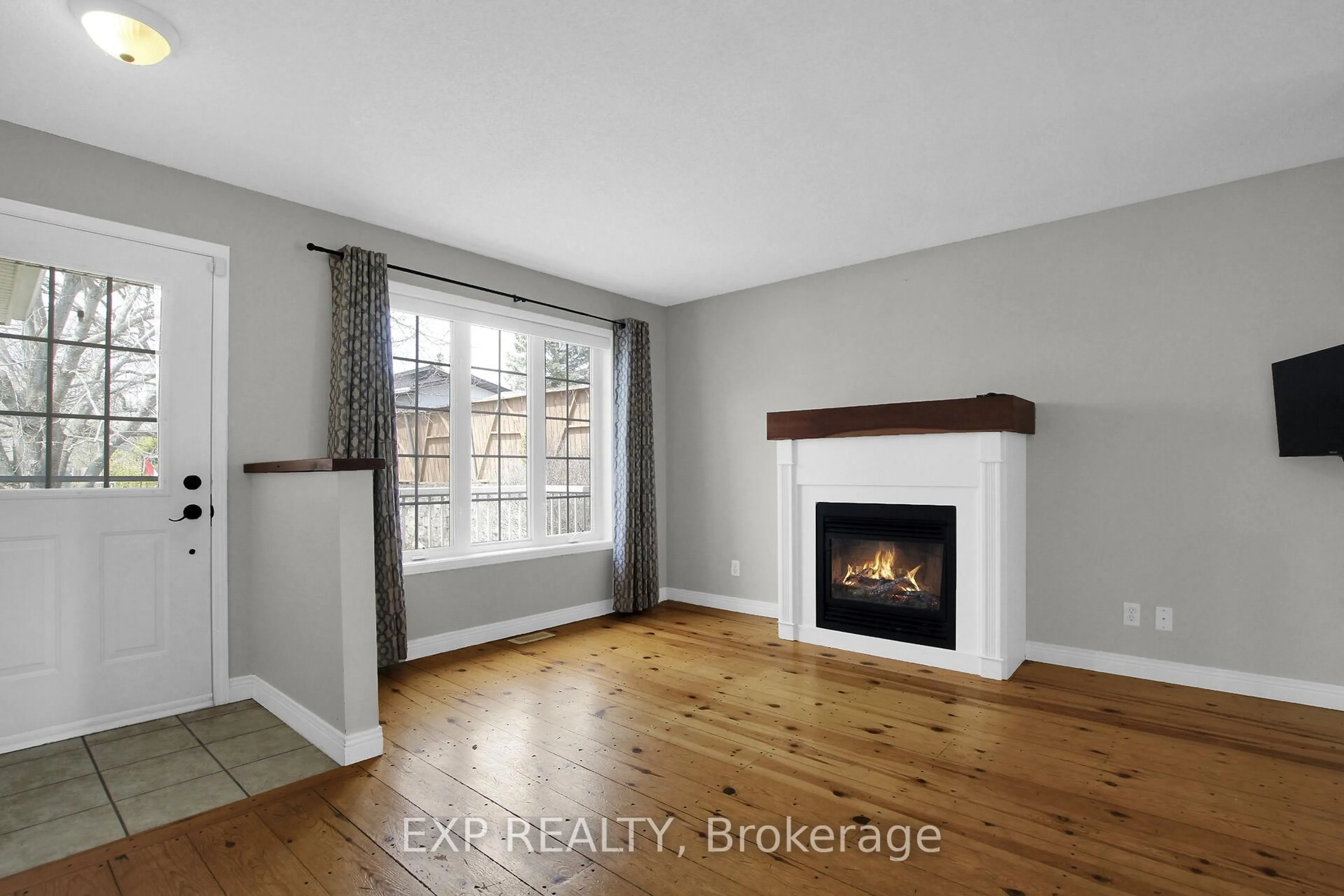 Living room with furniture, wood/laminate floor for 277 Gore St, Almonte Ontario K0A 1A0