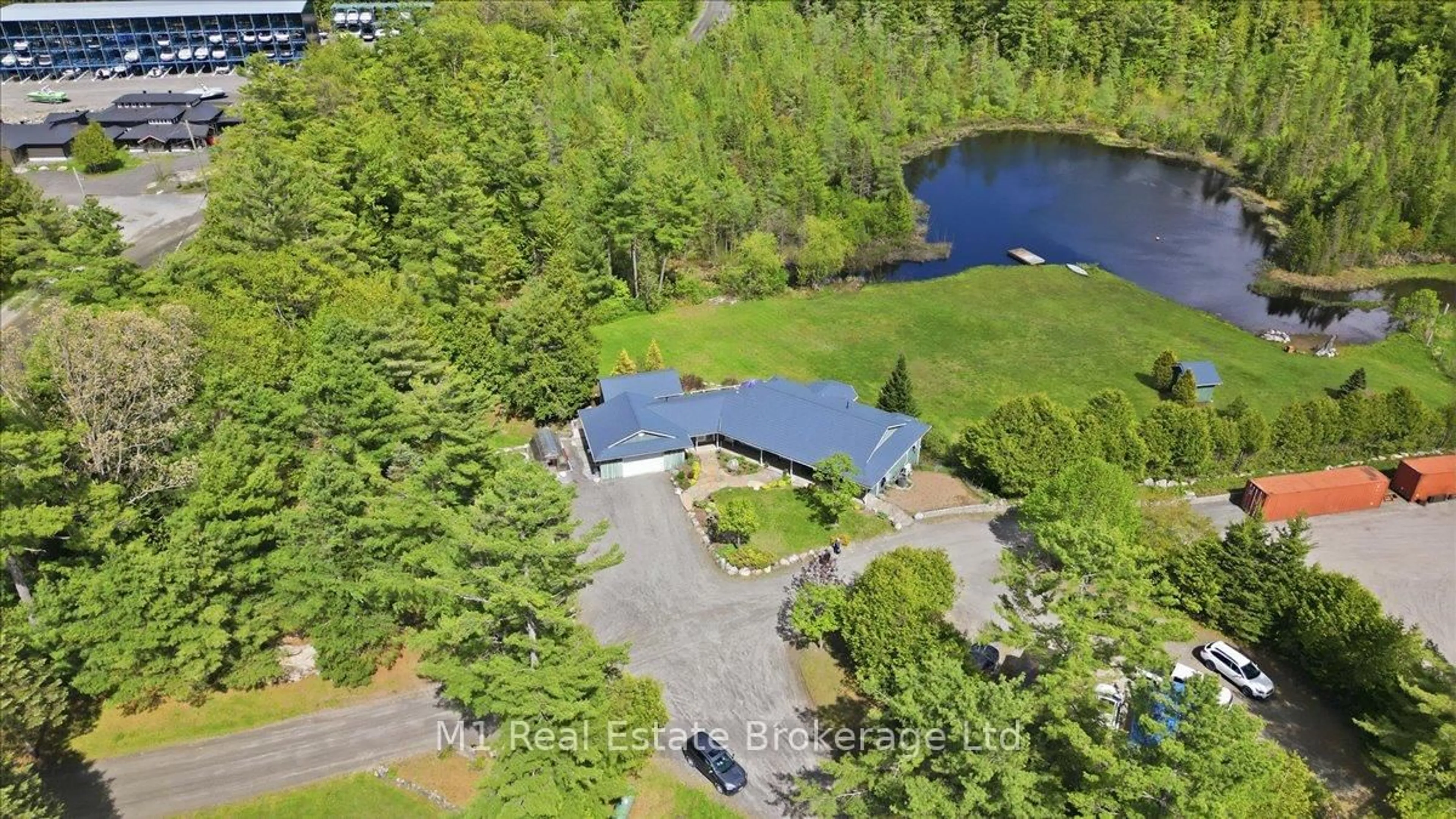 A pic from outside/outdoor area/front of a property/back of a property/a pic from drone, water/lake/river/ocean view for 60 Hamer Bay Rd, Seguin Ontario P0C 1H0