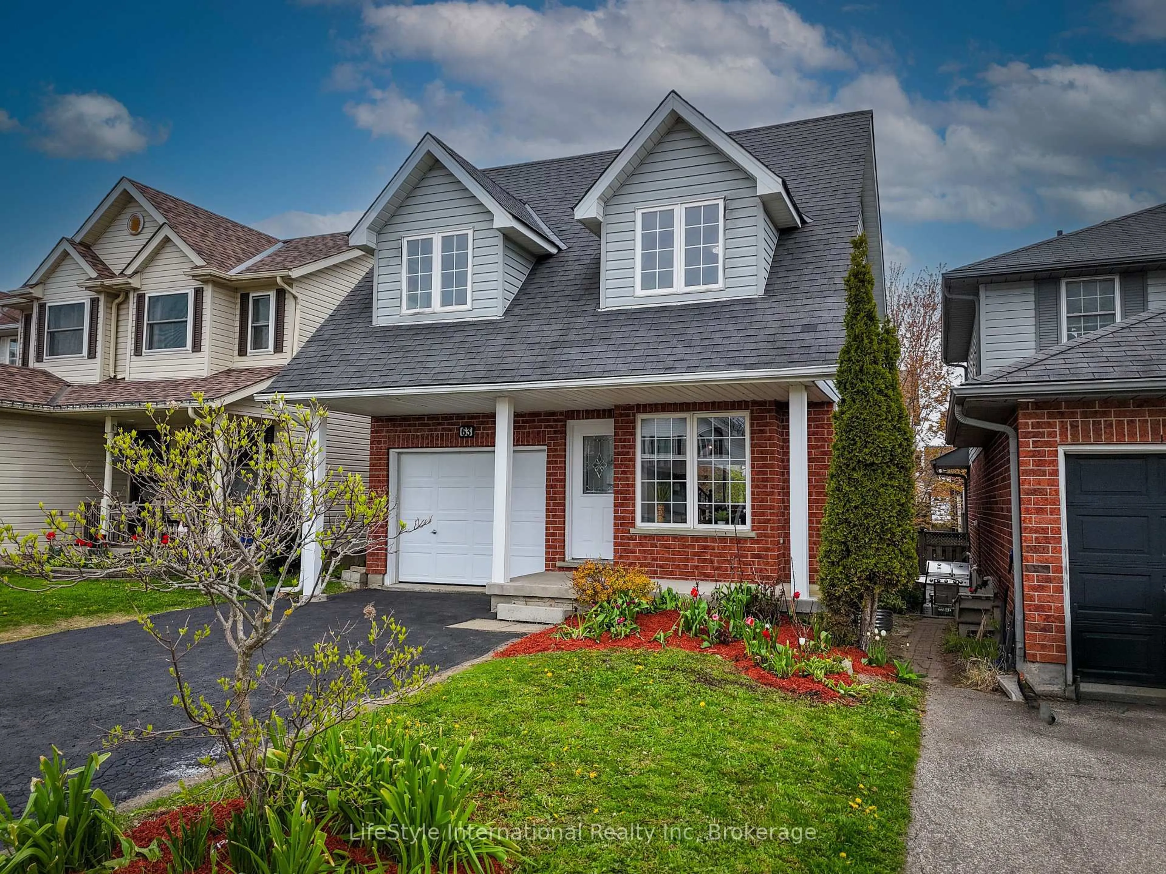 Home with brick exterior material, street for 63 Hagan Ave, Guelph Ontario N1E 7B7