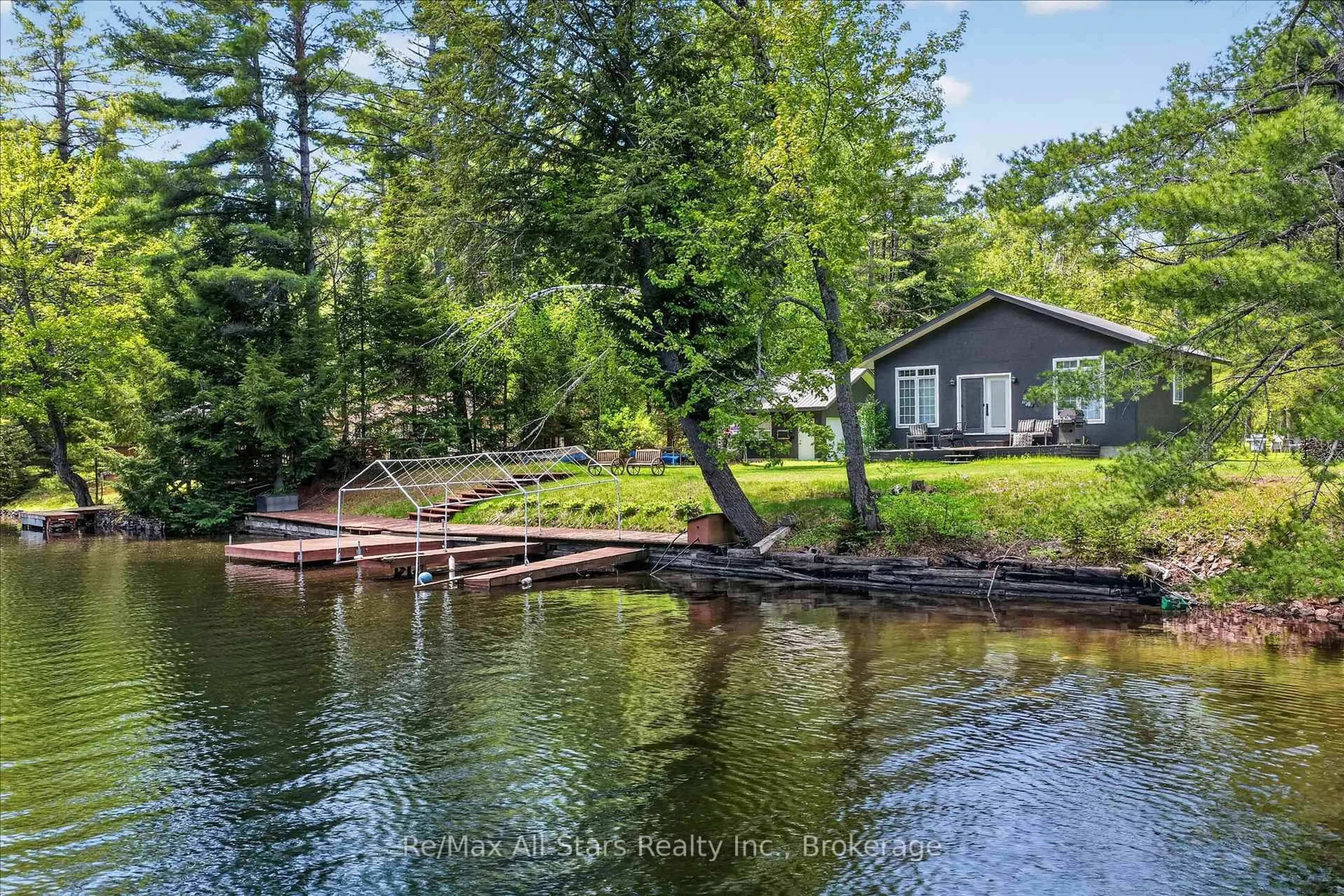 A pic from outside/outdoor area/front of a property/back of a property/a pic from drone, water/lake/river/ocean view for 24 Relax Ave, Kawartha Lakes Ontario K0M 2L0