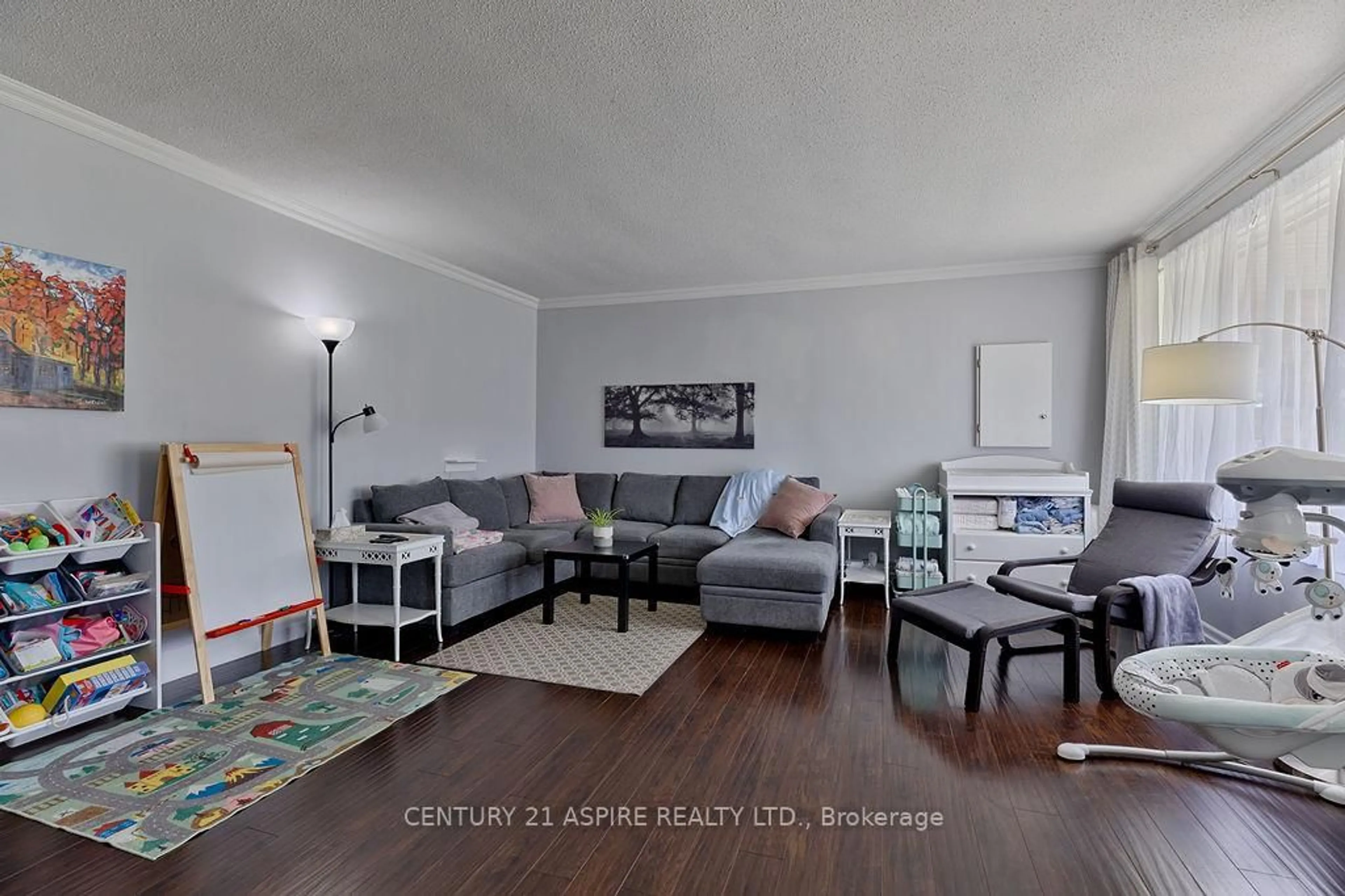 Living room with furniture, wood/laminate floor for 227 Clemow Ave, Pembroke Ontario K8A 2C7