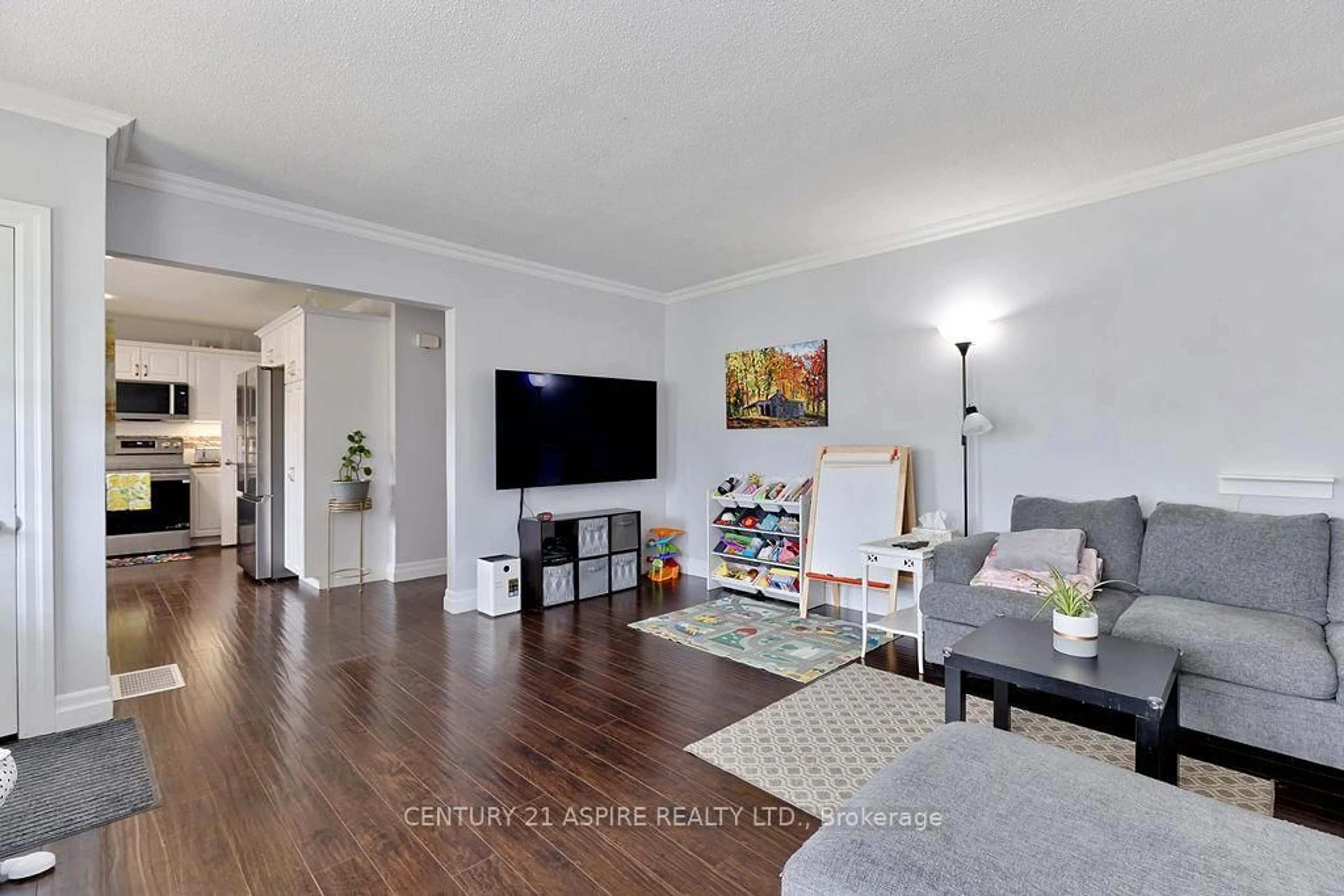 Living room with furniture, wood/laminate floor for 227 Clemow Ave, Pembroke Ontario K8A 2C7