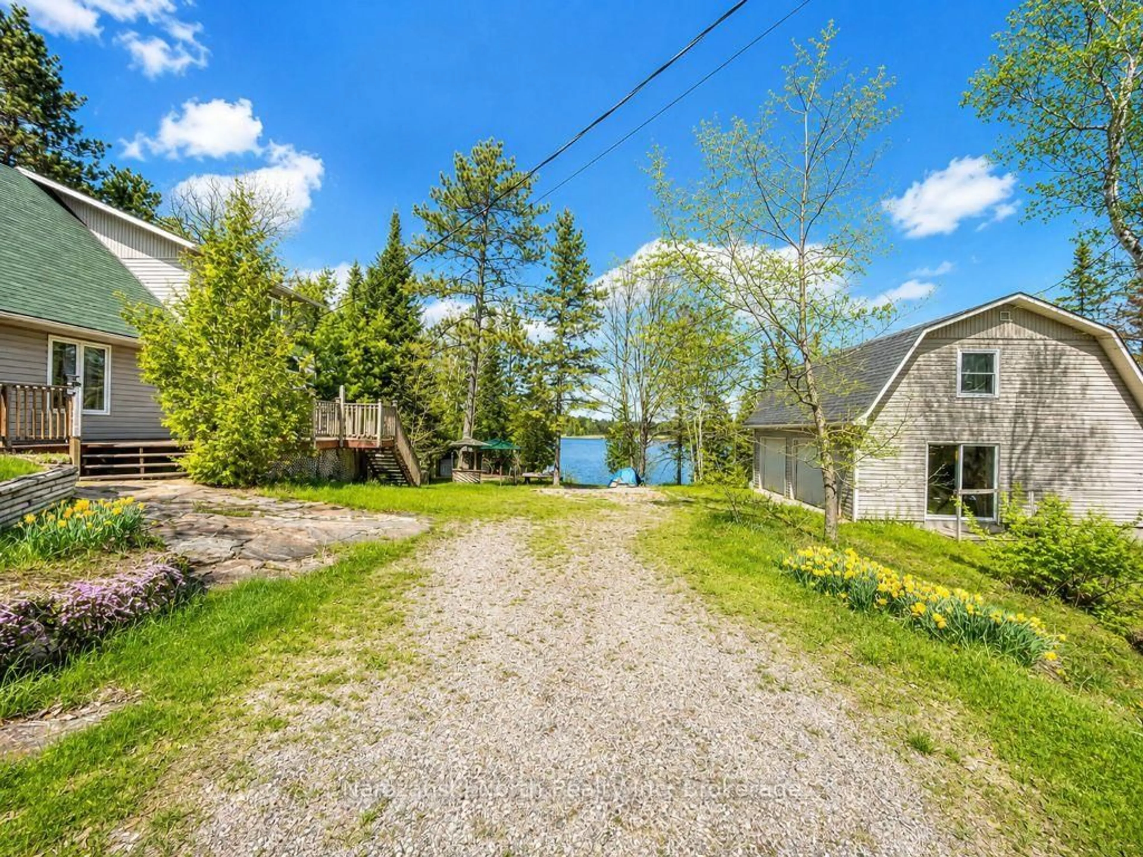 A pic from outside/outdoor area/front of a property/back of a property/a pic from drone, water/lake/river/ocean view for 6051 Hwy 64, French River Ontario P0M 2N0