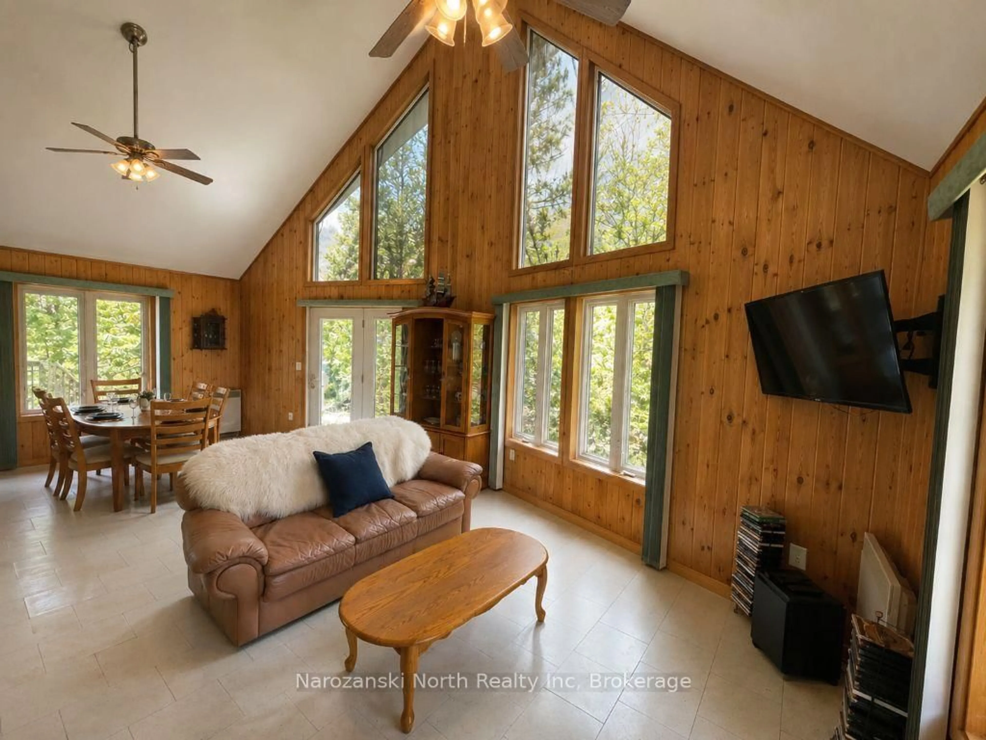 Living room with furniture, wood/laminate floor for 6051 Hwy 64, French River Ontario P0M 2N0