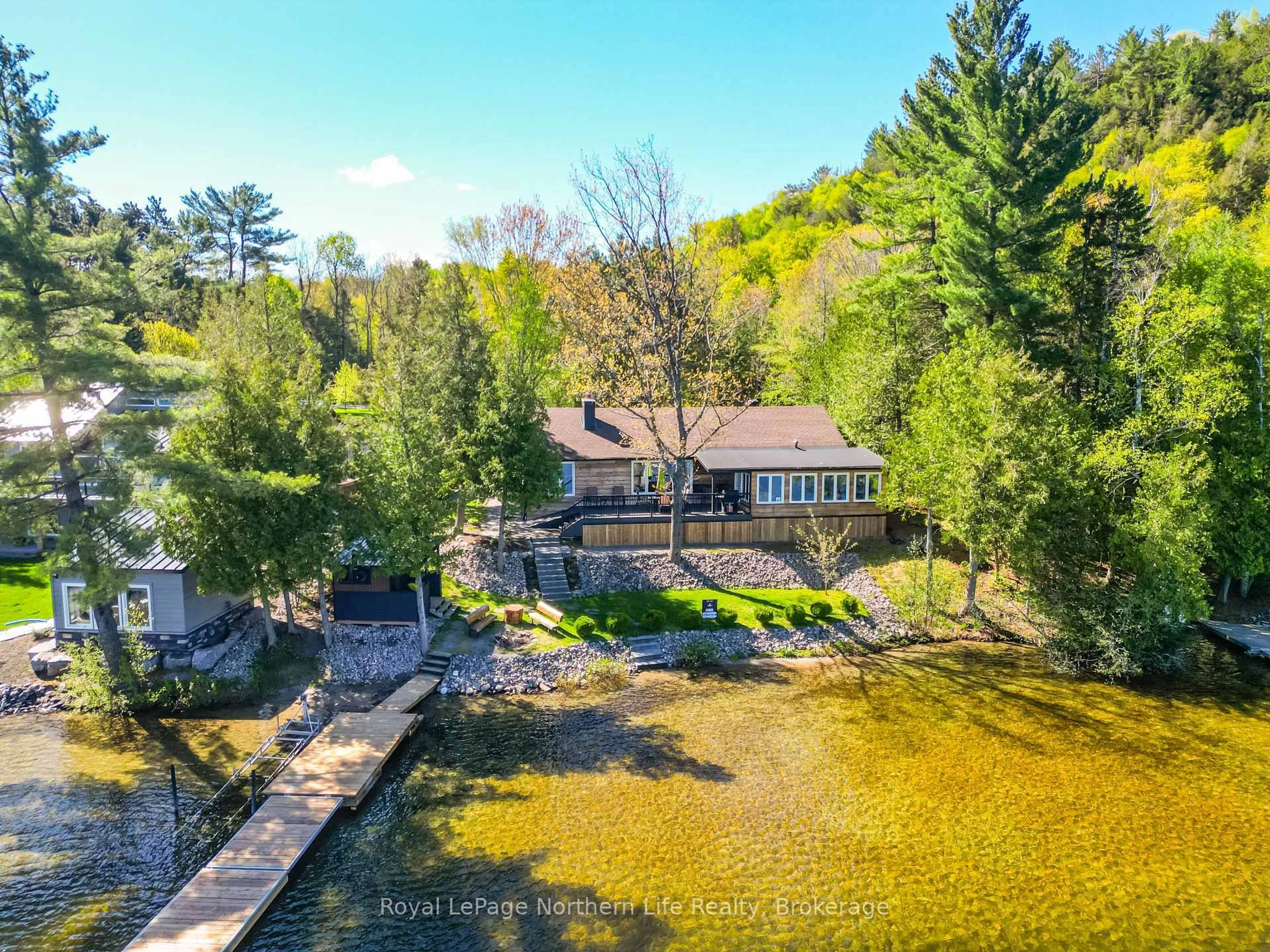 A pic from outside/outdoor area/front of a property/back of a property/a pic from drone, water/lake/river/ocean view for 131 West Peninsula Rd, North Bay Ontario P1B 8G4