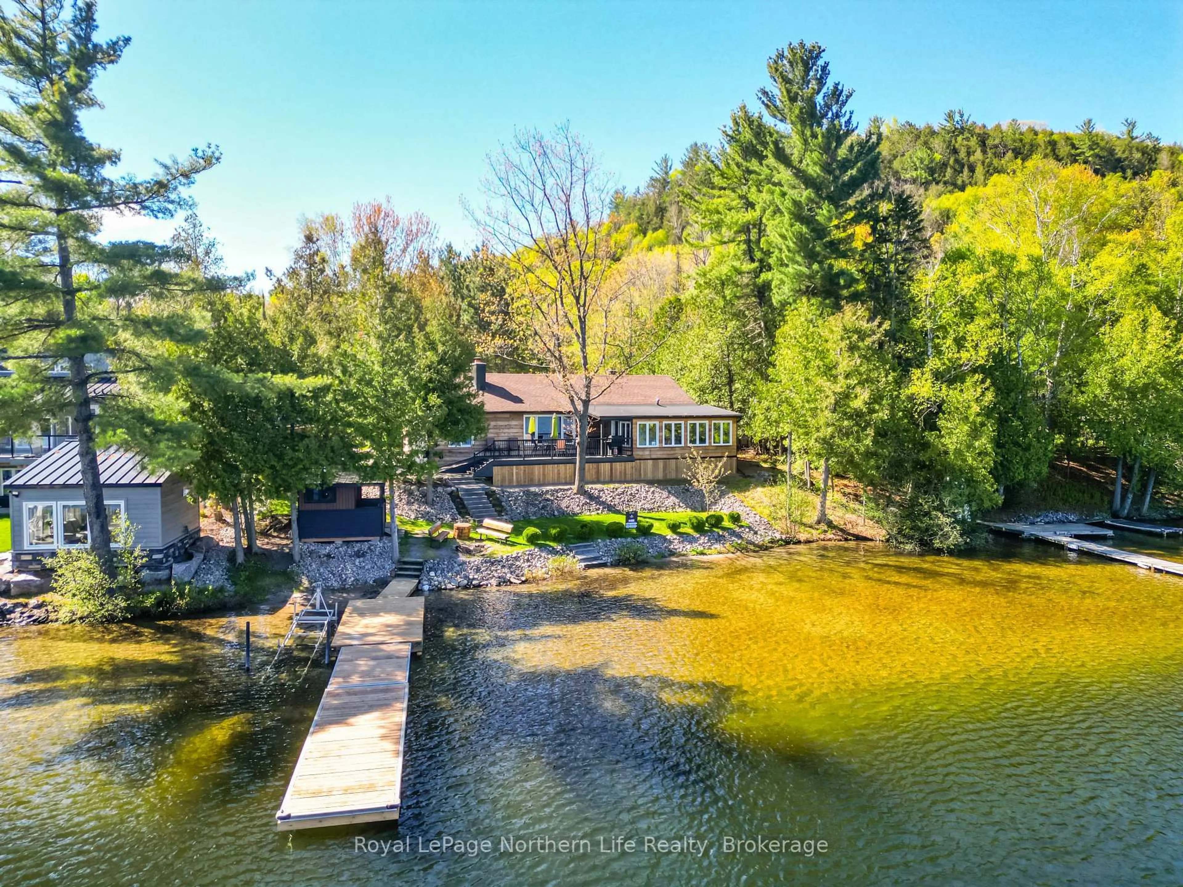 A pic from outside/outdoor area/front of a property/back of a property/a pic from drone, water/lake/river/ocean view for 131 West Peninsula Rd, North Bay Ontario P1B 8G4