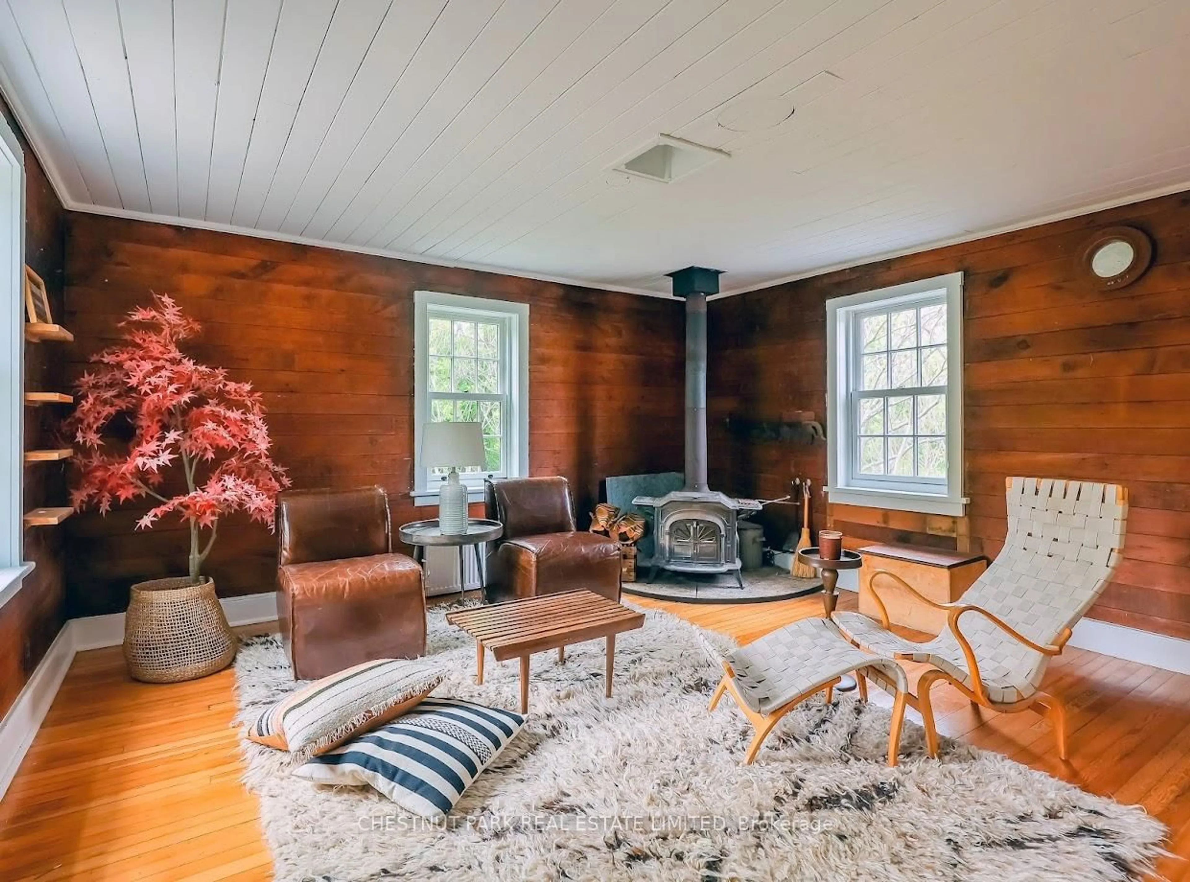 Living room with furniture, wood/laminate floor for 1 Station Rd, Prince Edward County Ontario K0K 1J0