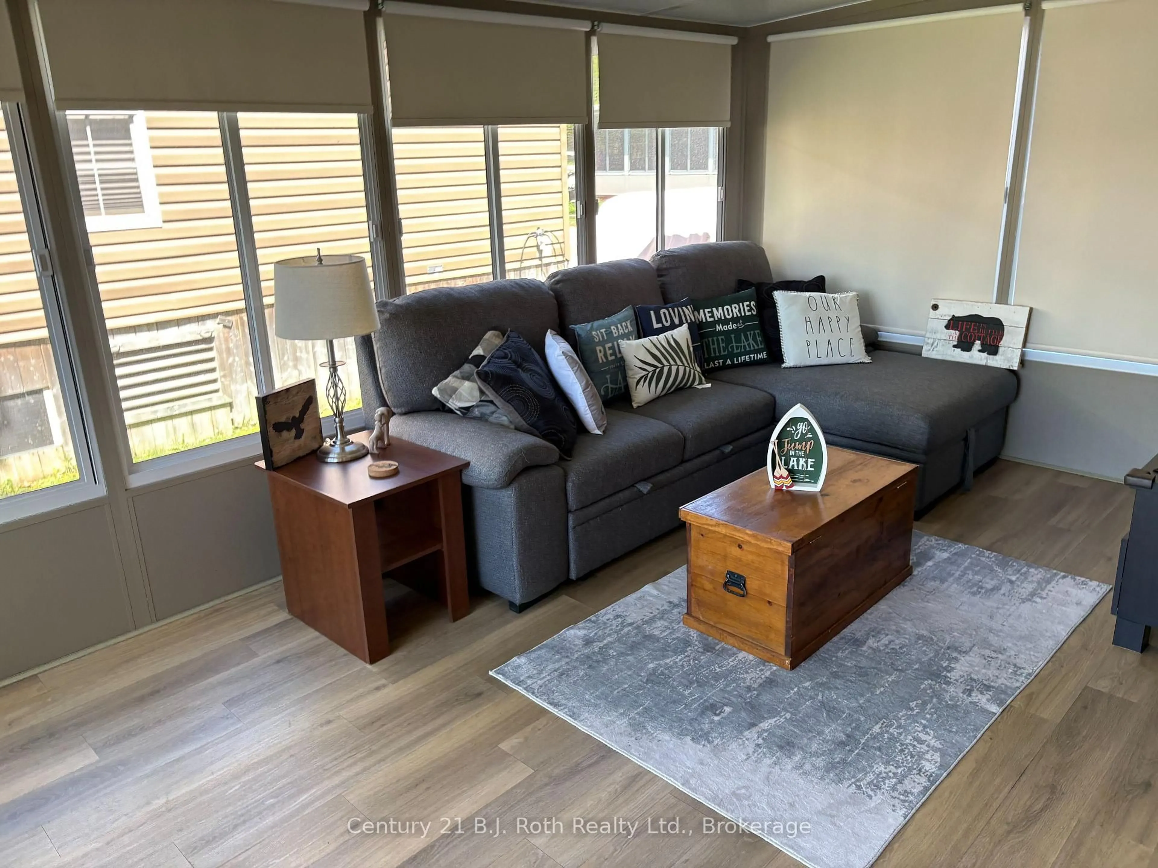Living room with furniture, wood/laminate floor for 1336 South Morrison Lake Rd #31 Riverside Village, Gravenhurst Ontario P0E 1N0