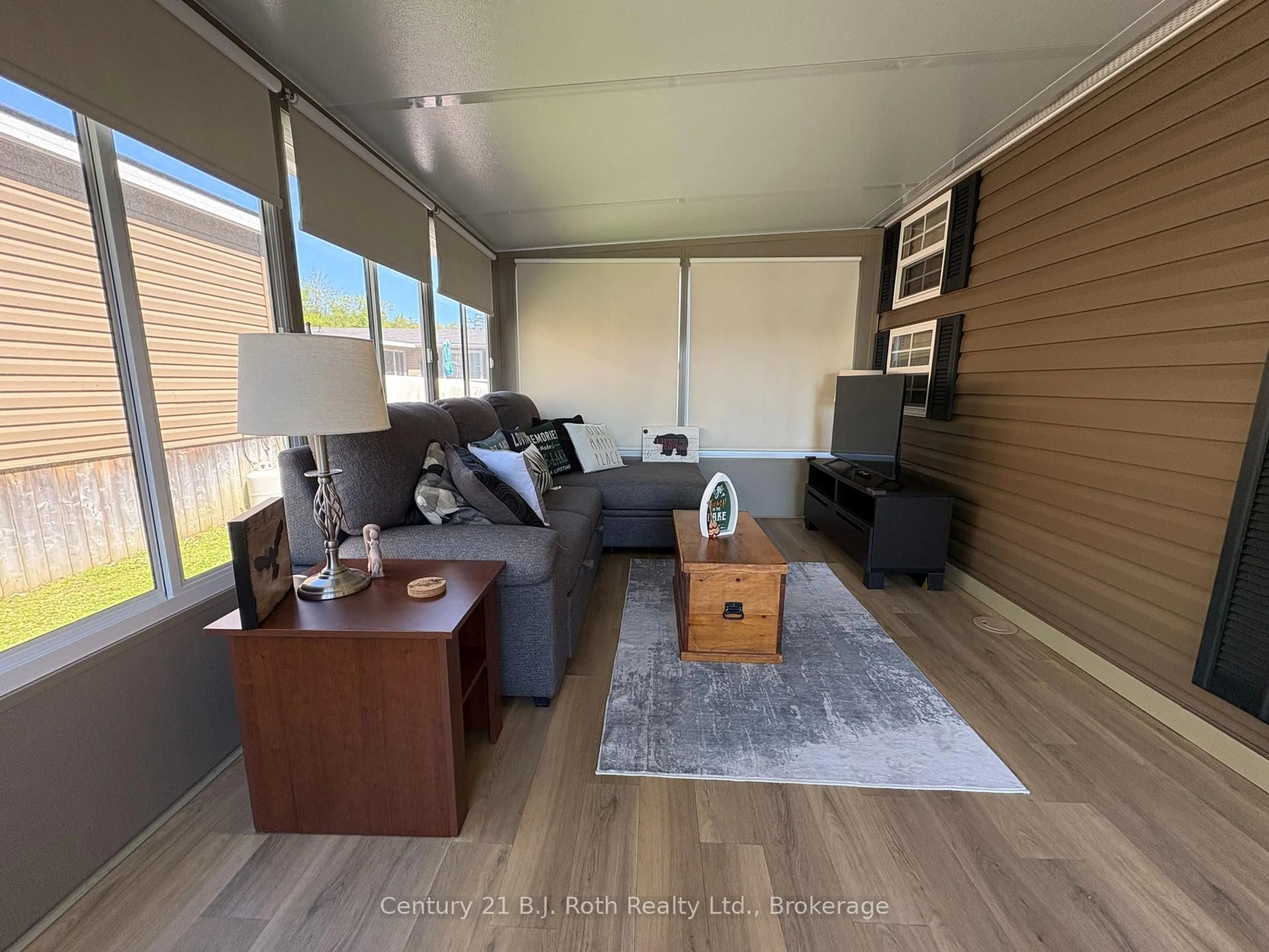 Living room with furniture, wood/laminate floor for 1336 South Morrison Lake Rd #31 Riverside Village, Gravenhurst Ontario P0E 1N0
