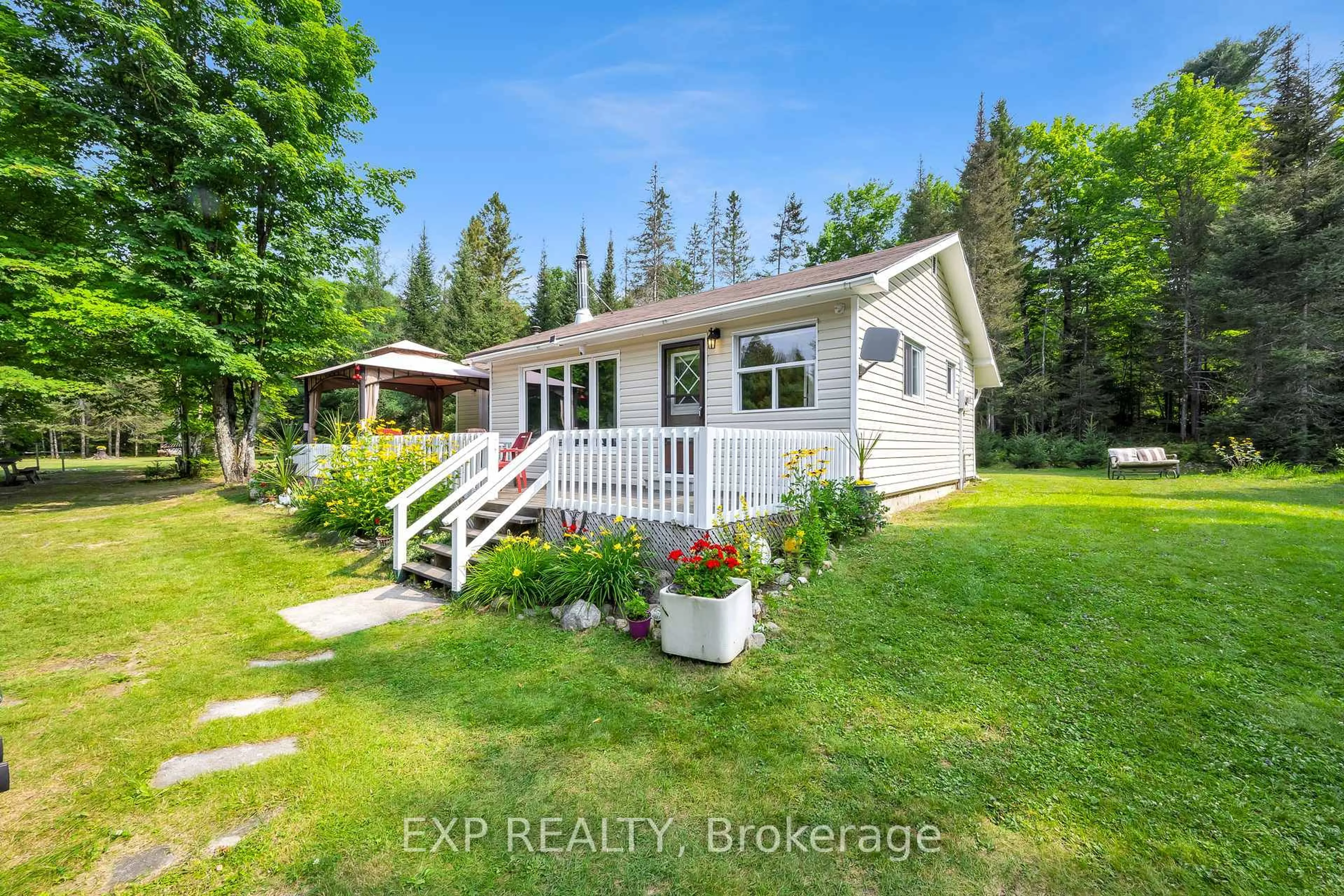 A pic from outside/outdoor area/front of a property/back of a property/a pic from drone, water/lake/river/ocean view for 2288 Eagle Lake Rd, Machar Ontario P0A 1X0