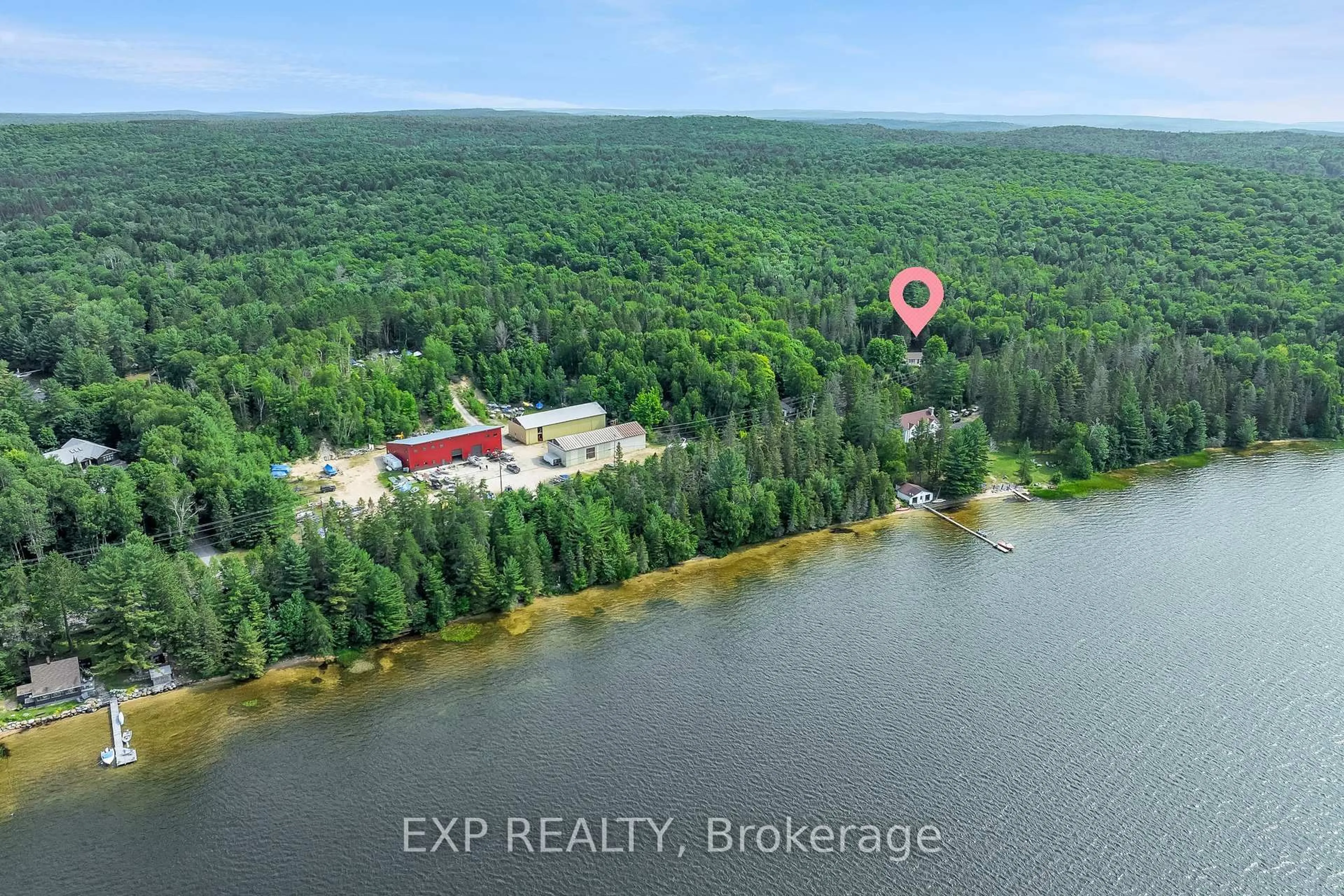 A pic from outside/outdoor area/front of a property/back of a property/a pic from drone, water/lake/river/ocean view for 2288 Eagle Lake Rd, Machar Ontario P0A 1X0