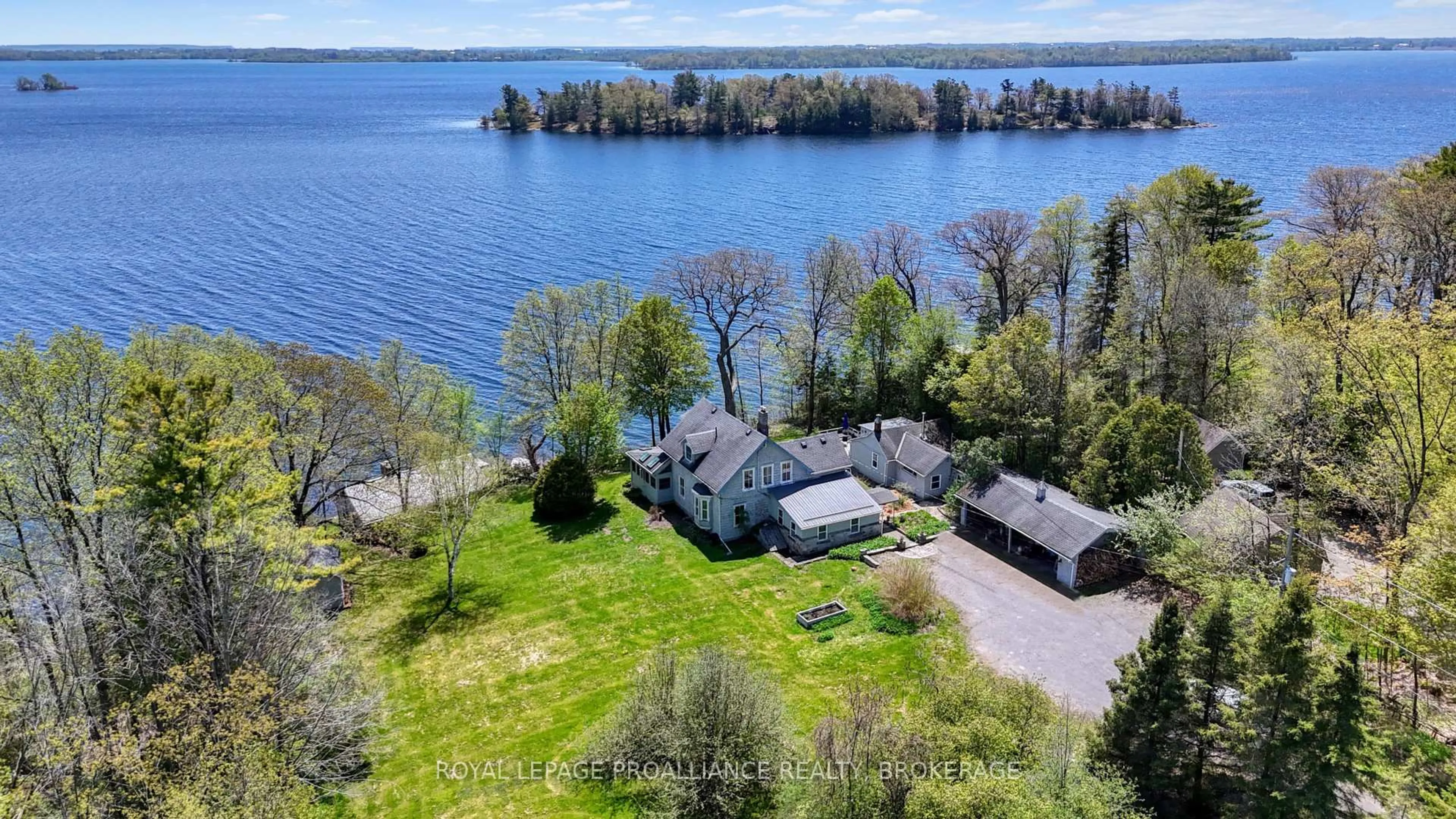 A pic from outside/outdoor area/front of a property/back of a property/a pic from drone, water/lake/river/ocean view for 1295 Highway 2, Kingston Ontario K7L 4V1