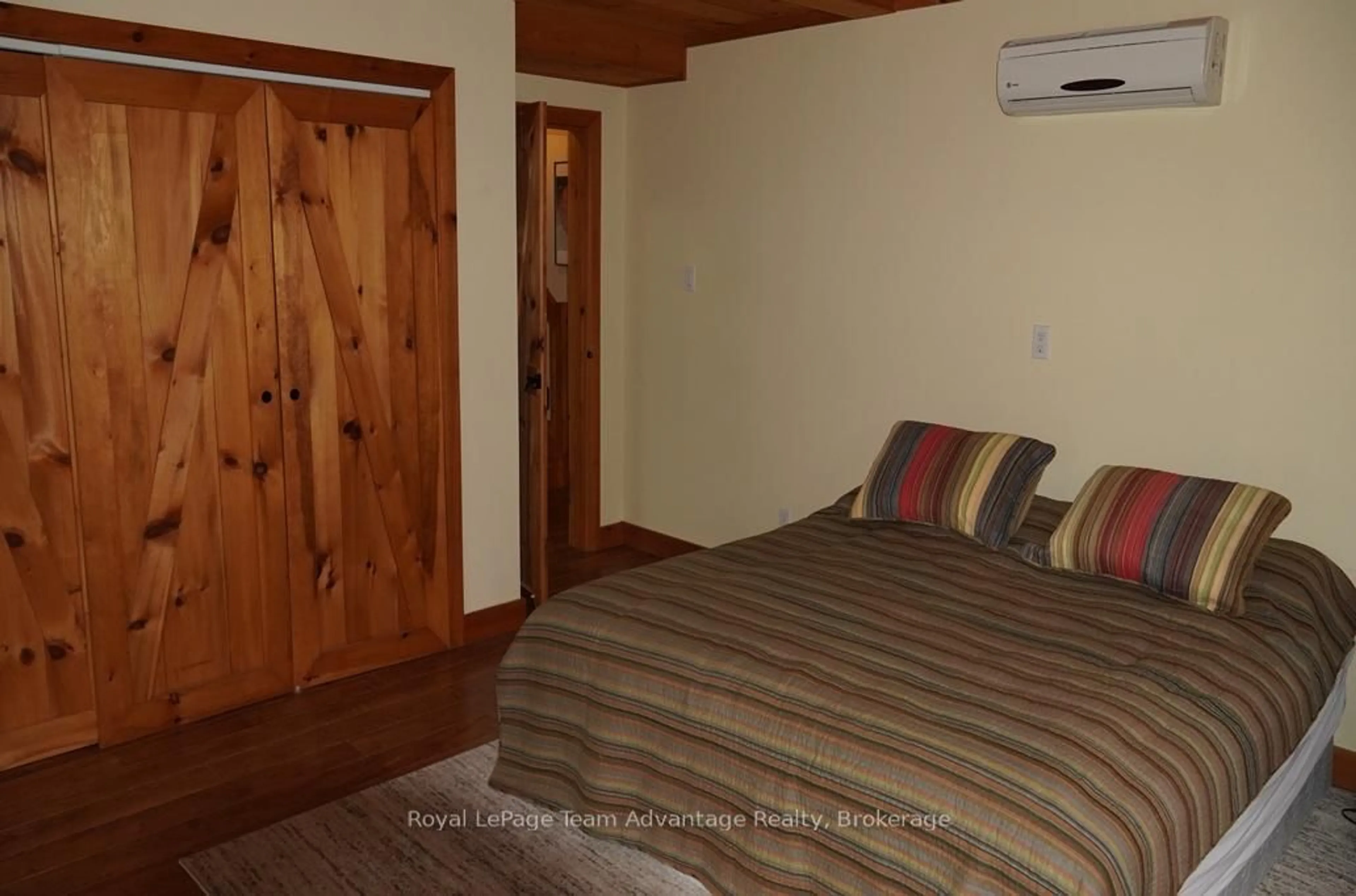 Bedroom with bed, wood/laminate floor for 768 Hurdville Rd, McKellar Ontario P2A 0B5