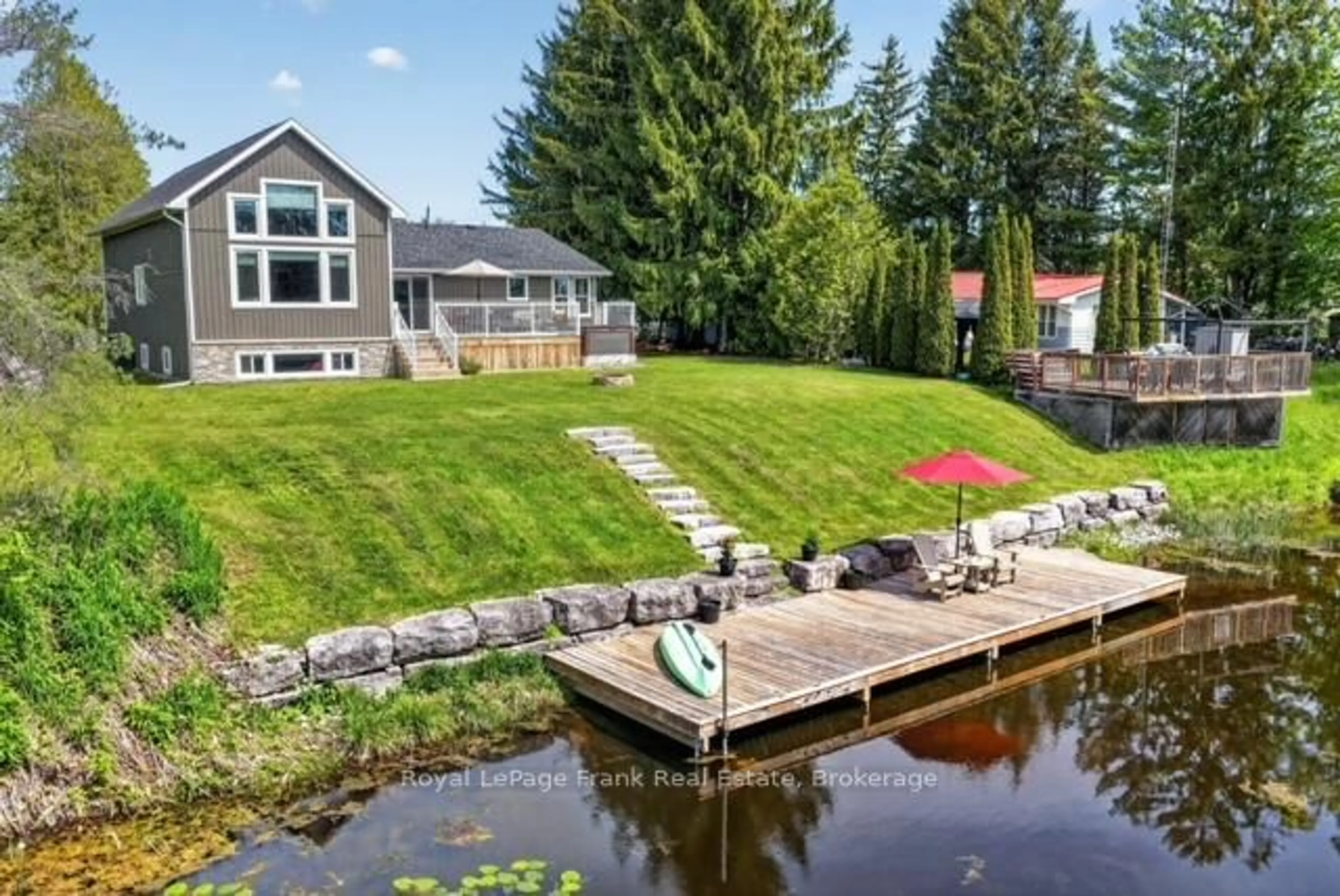 A pic from outside/outdoor area/front of a property/back of a property/a pic from drone, water/lake/river/ocean view for 34 Rideau Dr, Kawartha Lakes Ontario K0M 1N0
