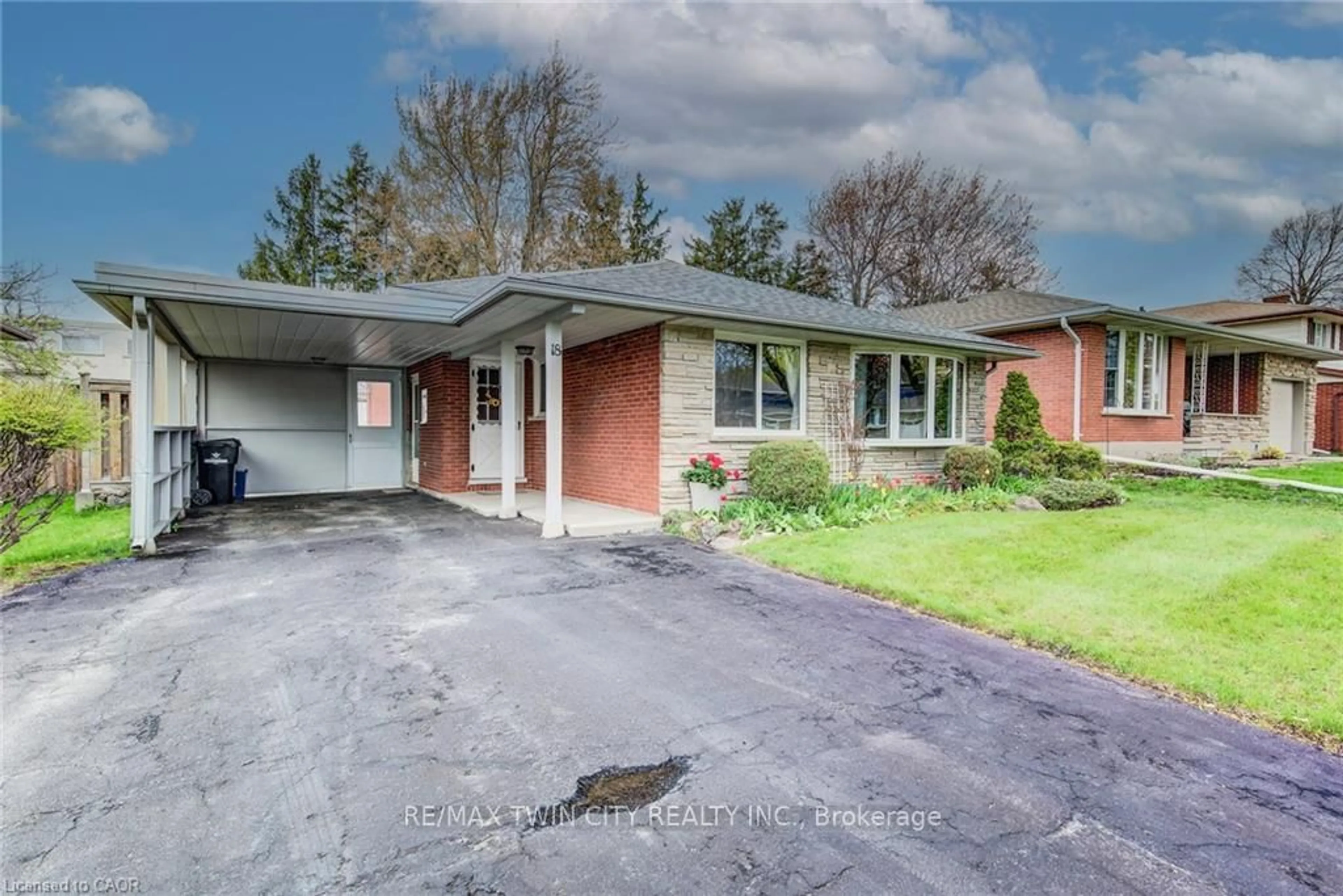 Home with brick exterior material, street for 18 QUEENSTON Cres, Kitchener Ontario N2B 2V5