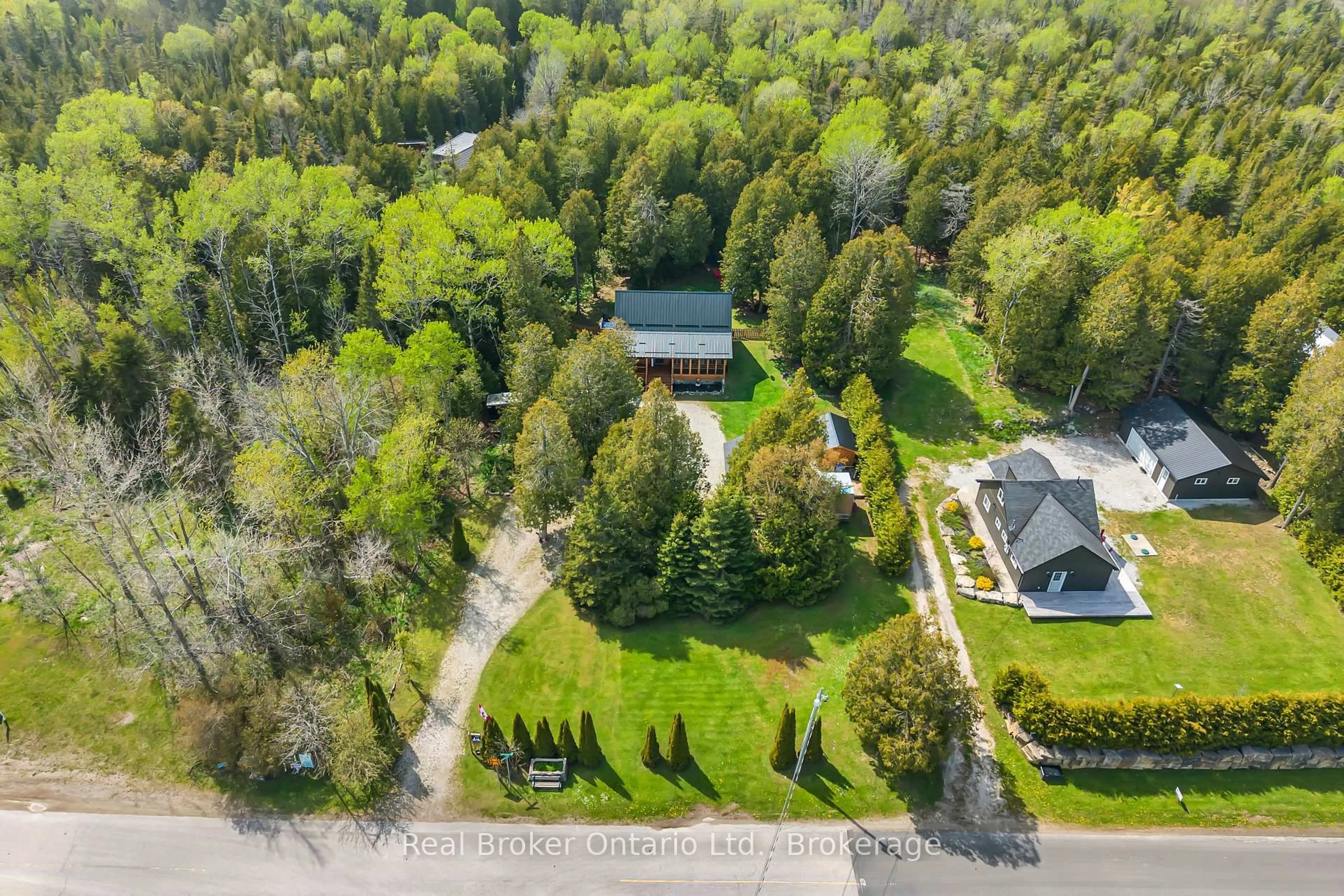 A pic from outside/outdoor area/front of a property/back of a property/a pic from drone, forest/trees view for 595 Stokes Bay Rd, Northern Bruce Peninsula Ontario N0H 1W0