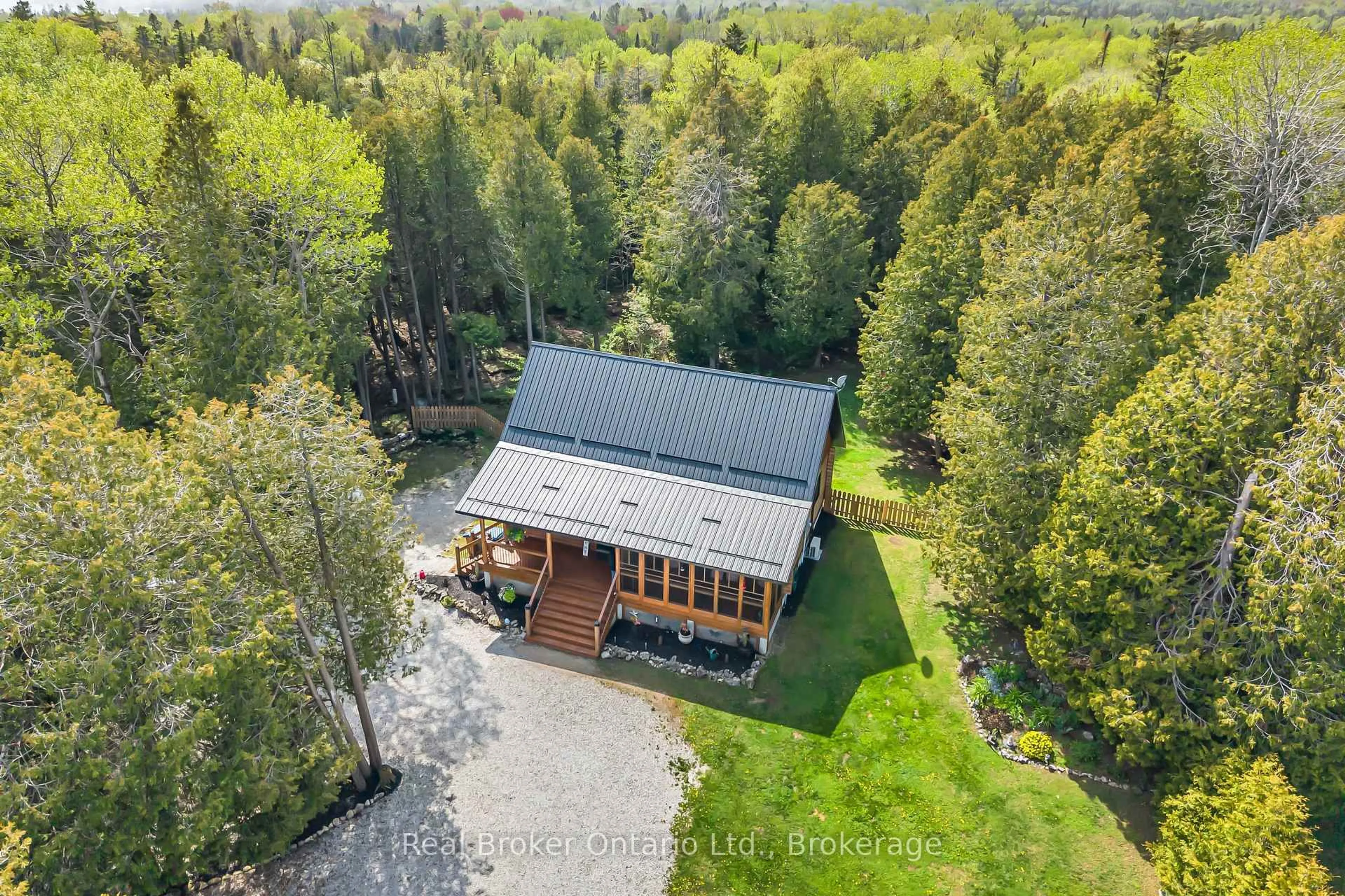 A pic from outside/outdoor area/front of a property/back of a property/a pic from drone, forest/trees view for 595 Stokes Bay Rd, Northern Bruce Peninsula Ontario N0H 1W0