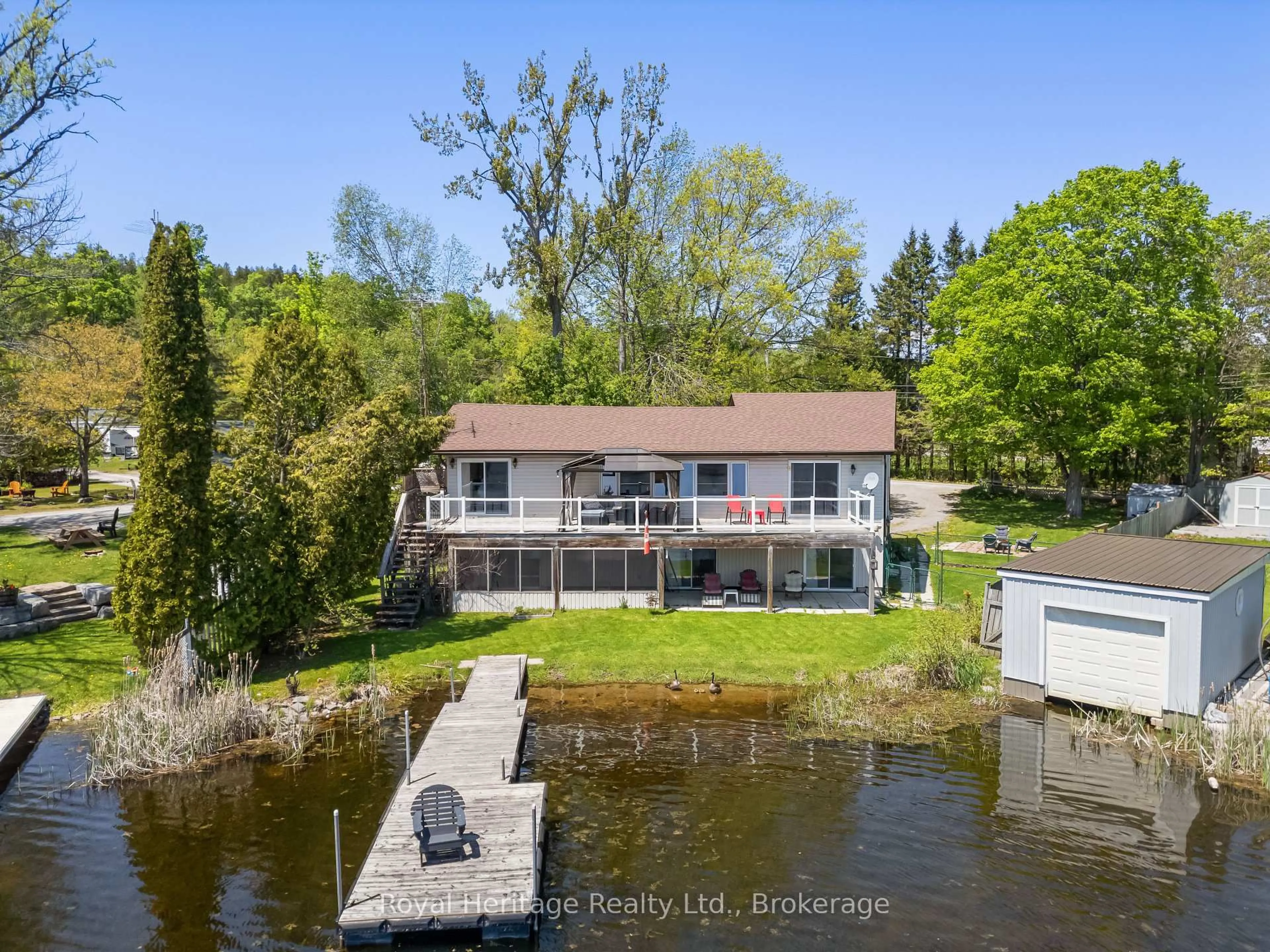 A pic from outside/outdoor area/front of a property/back of a property/a pic from drone, water/lake/river/ocean view for 16 Fire Route 122, Trent Lakes Ontario K0M 1A0