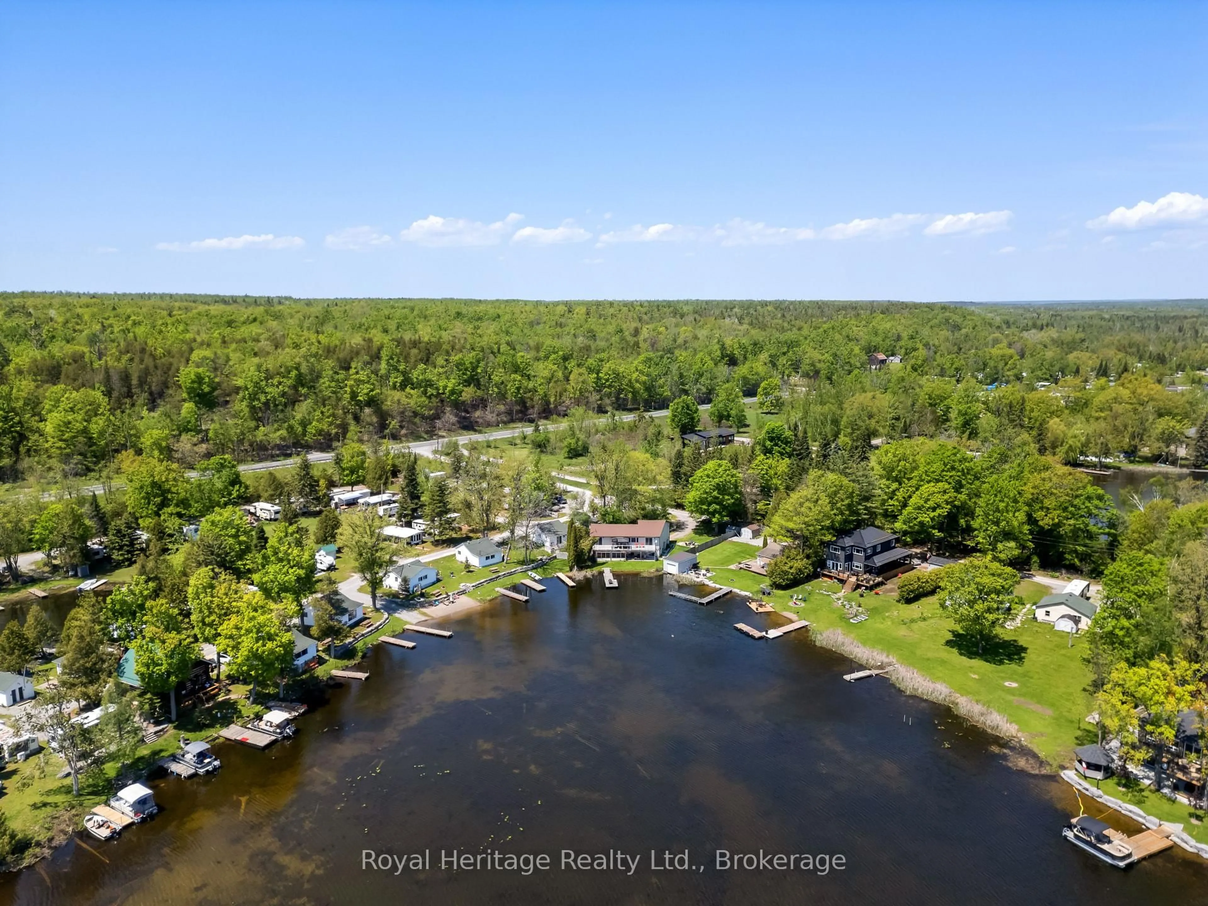 A pic from outside/outdoor area/front of a property/back of a property/a pic from drone, water/lake/river/ocean view for 16 Fire Route 122, Trent Lakes Ontario K0M 1A0