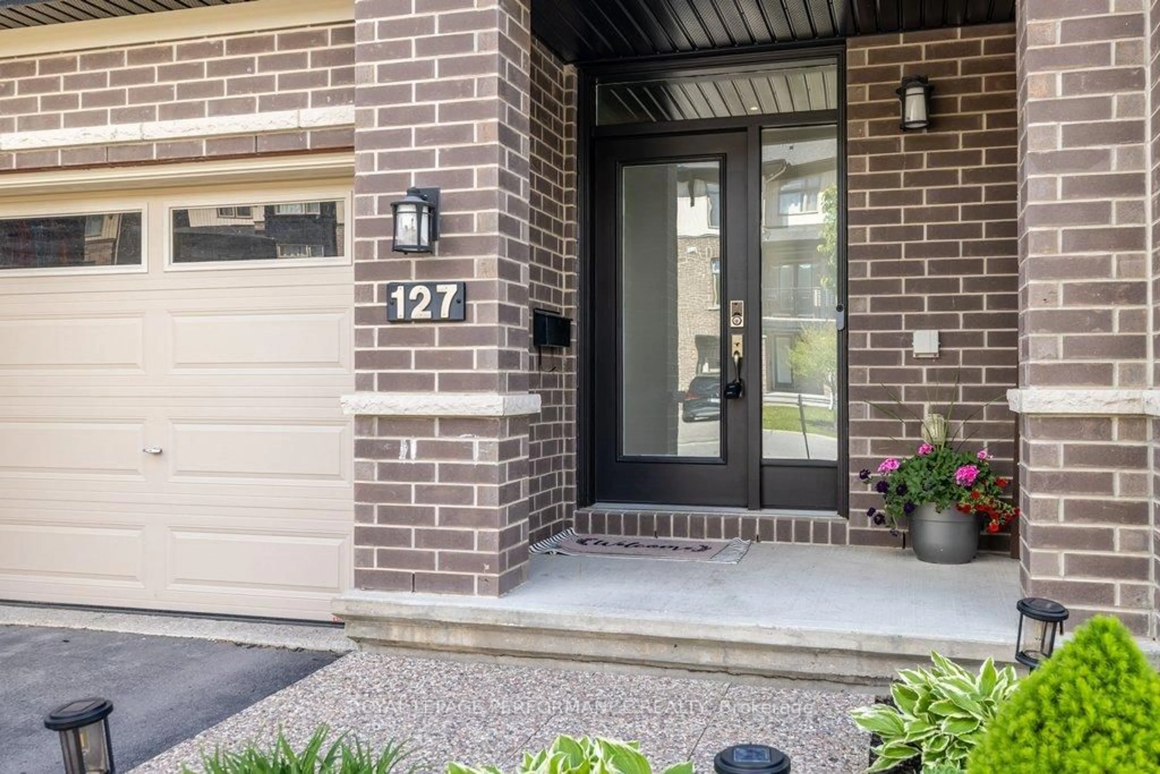 Home with brick exterior material, street for 127 Wild Calla Way, Ottawa Ontario K1W 0K4