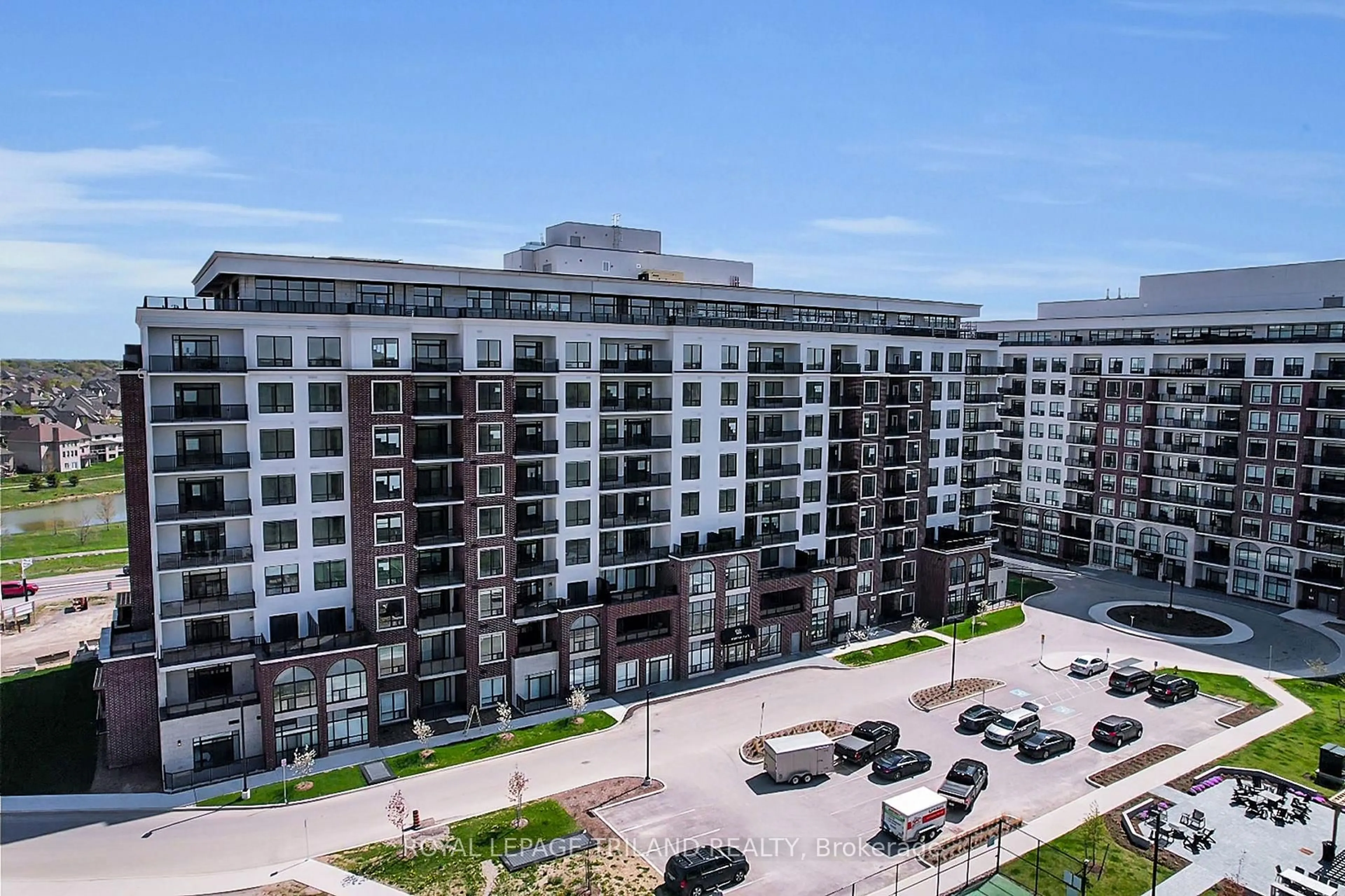 A pic from outside/outdoor area/front of a property/back of a property/a pic from drone, city buildings view from balcony for 480 Callaway Rd #215, London North Ontario N6G 0Z3
