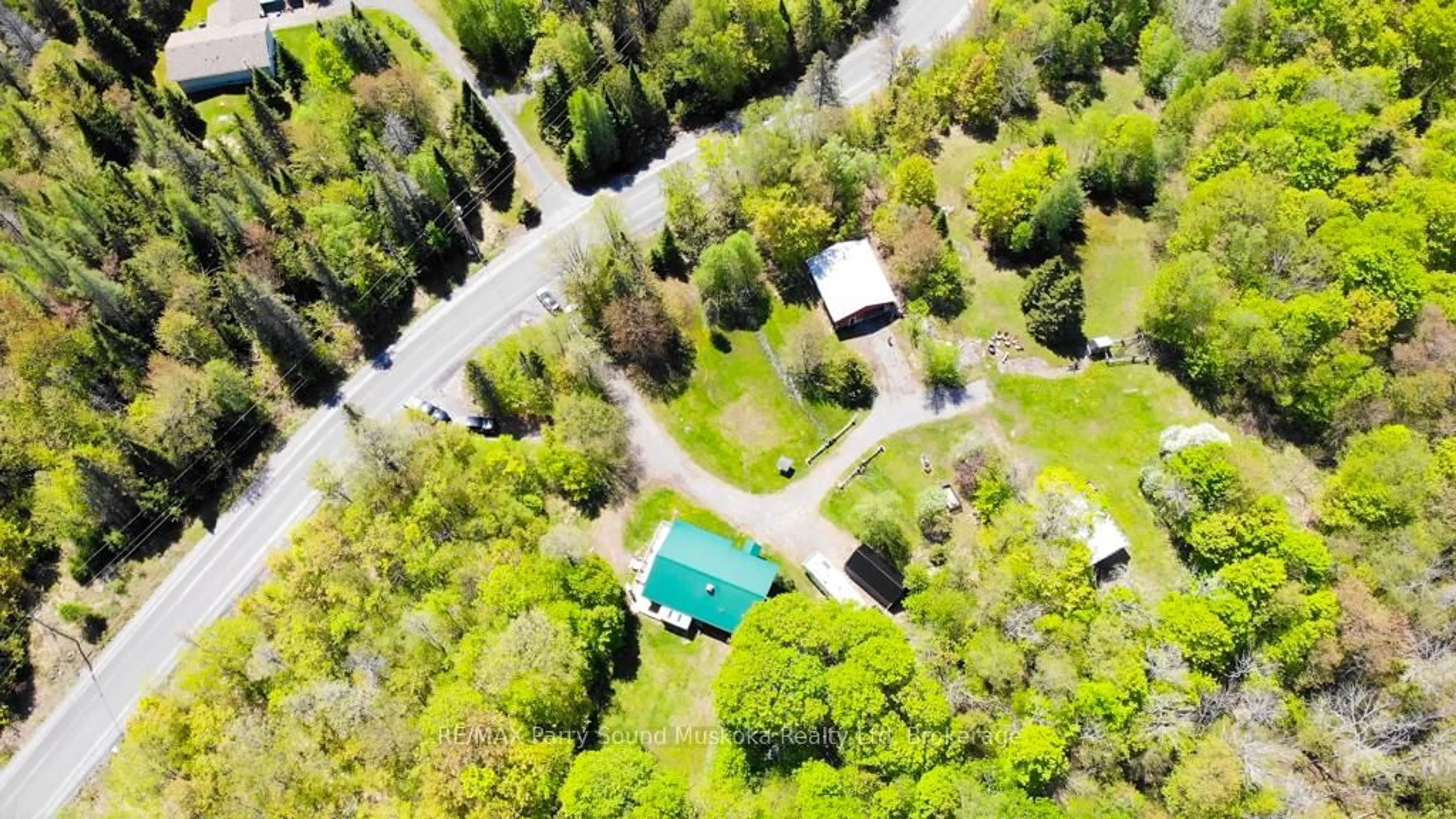 A pic from outside/outdoor area/front of a property/back of a property/a pic from drone, forest/trees view for 690 Hurdville Rd, McKellar Ontario P2A 2W7