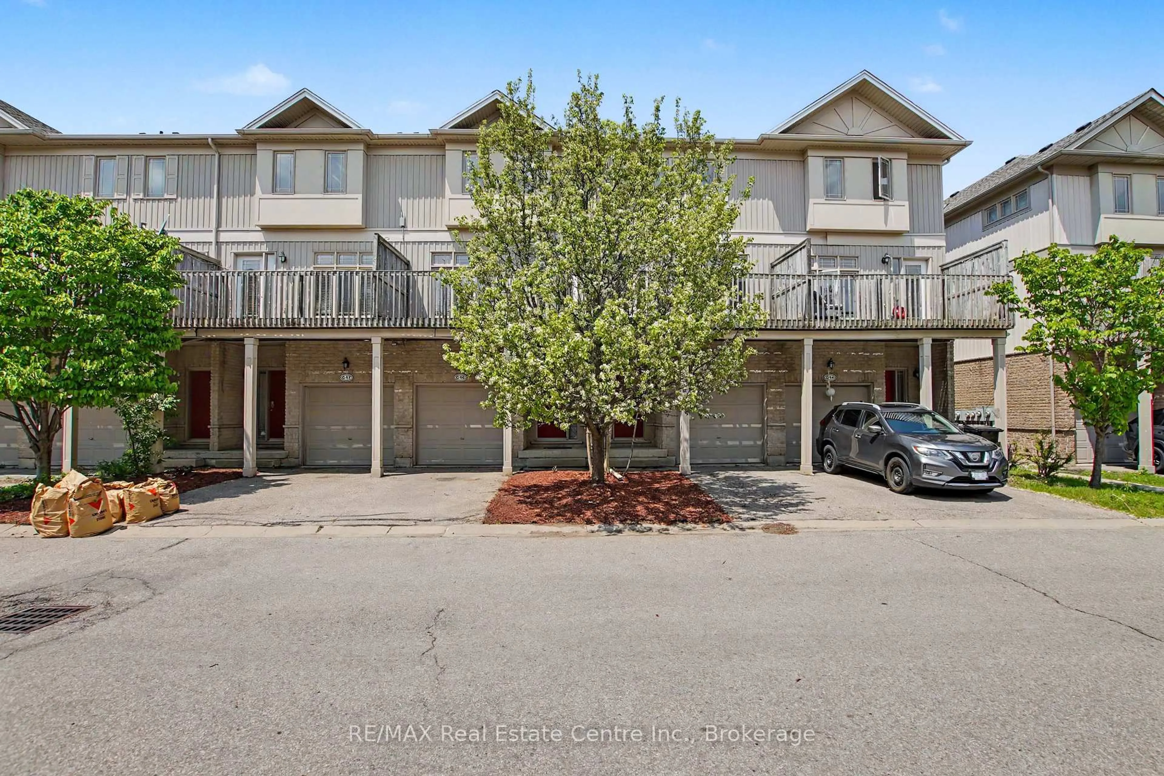 A pic from outside/outdoor area/front of a property/back of a property/a pic from drone, street for 619 Wild Ginger Ave #C15, Waterloo Ontario N2V 2X1