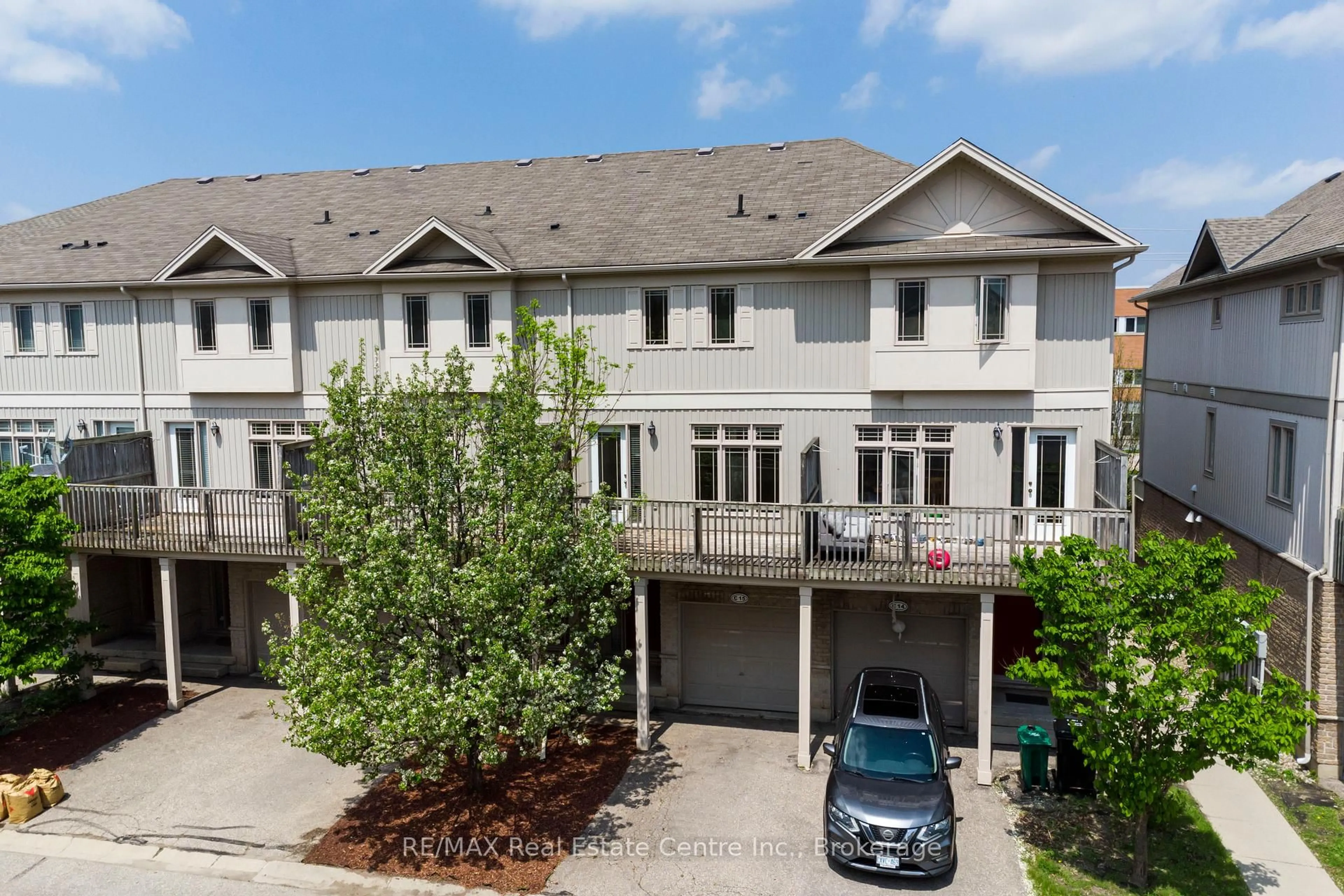 A pic from outside/outdoor area/front of a property/back of a property/a pic from drone, street for 619 Wild Ginger Ave #C15, Waterloo Ontario N2V 2X1