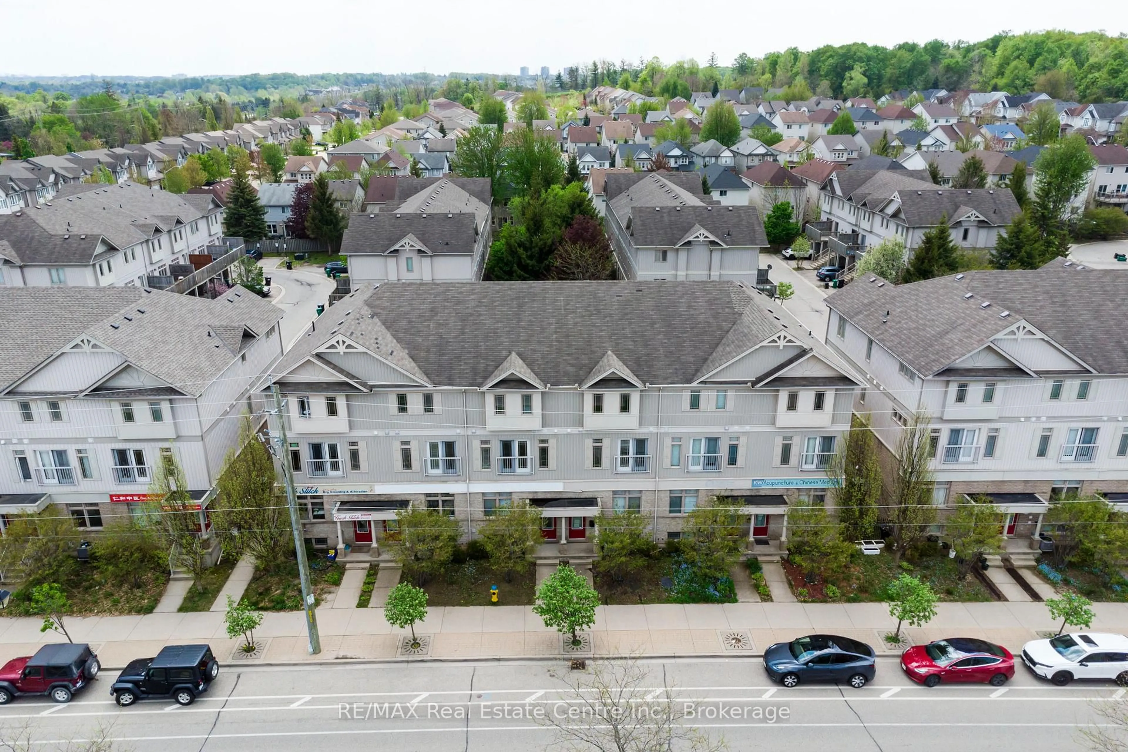 A pic from outside/outdoor area/front of a property/back of a property/a pic from drone, street for 619 Wild Ginger Ave #C16, Waterloo Ontario N2V 2X1