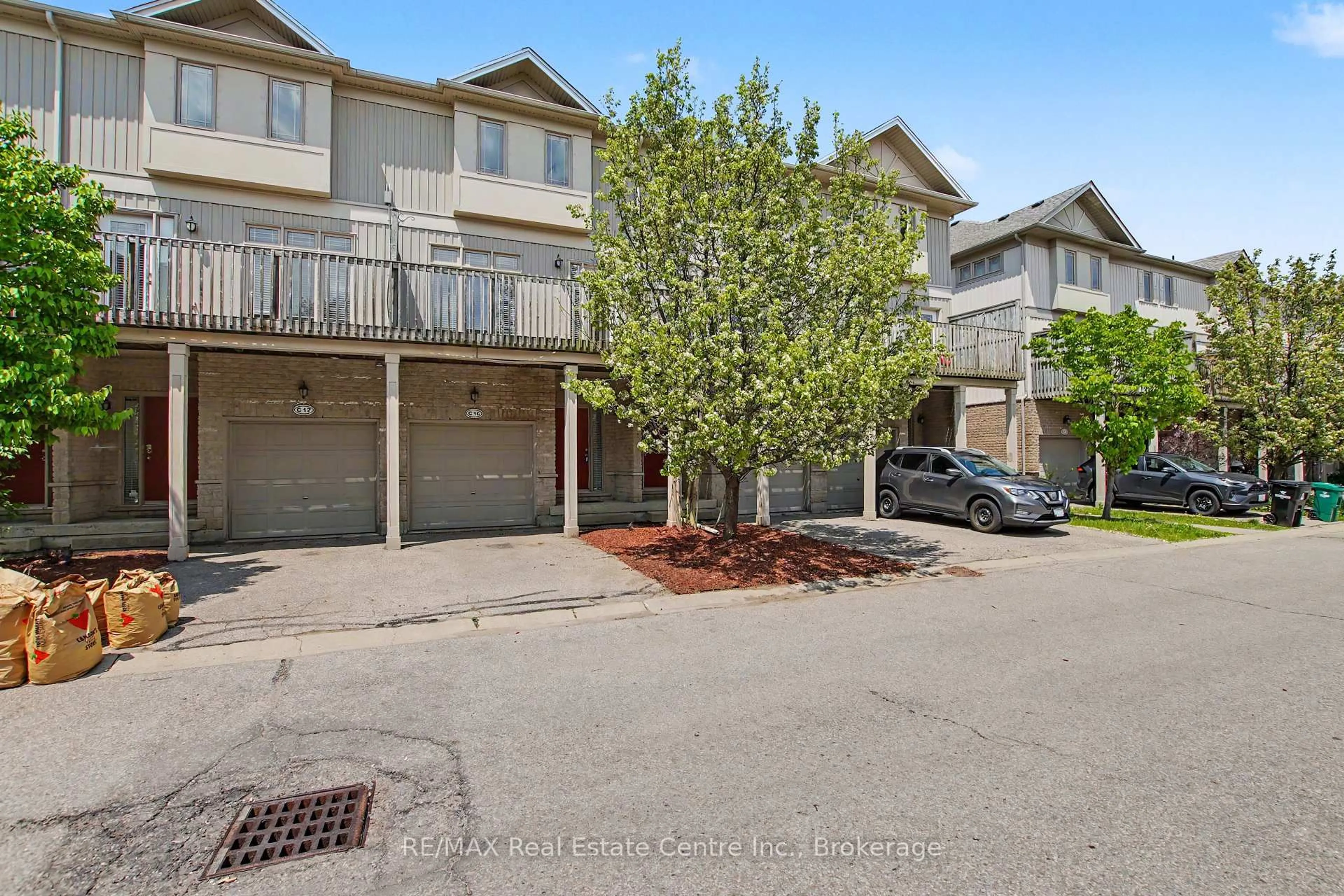 A pic from outside/outdoor area/front of a property/back of a property/a pic from drone, street for 619 Wild Ginger Ave #C16, Waterloo Ontario N2V 2X1