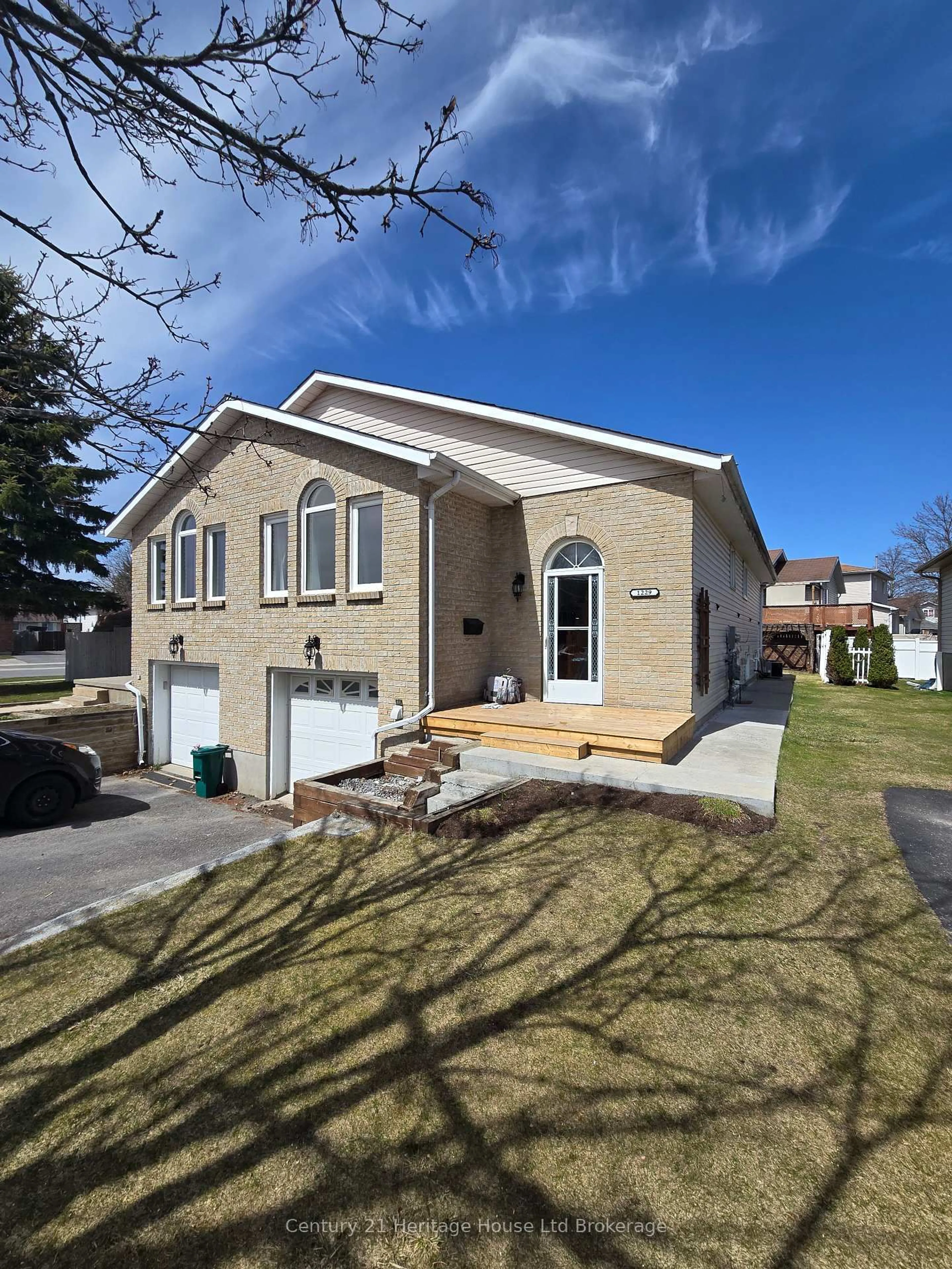 Home with vinyl exterior material, street for 1229 Brackenwood Cres, Kingston Ontario K7P 2W4