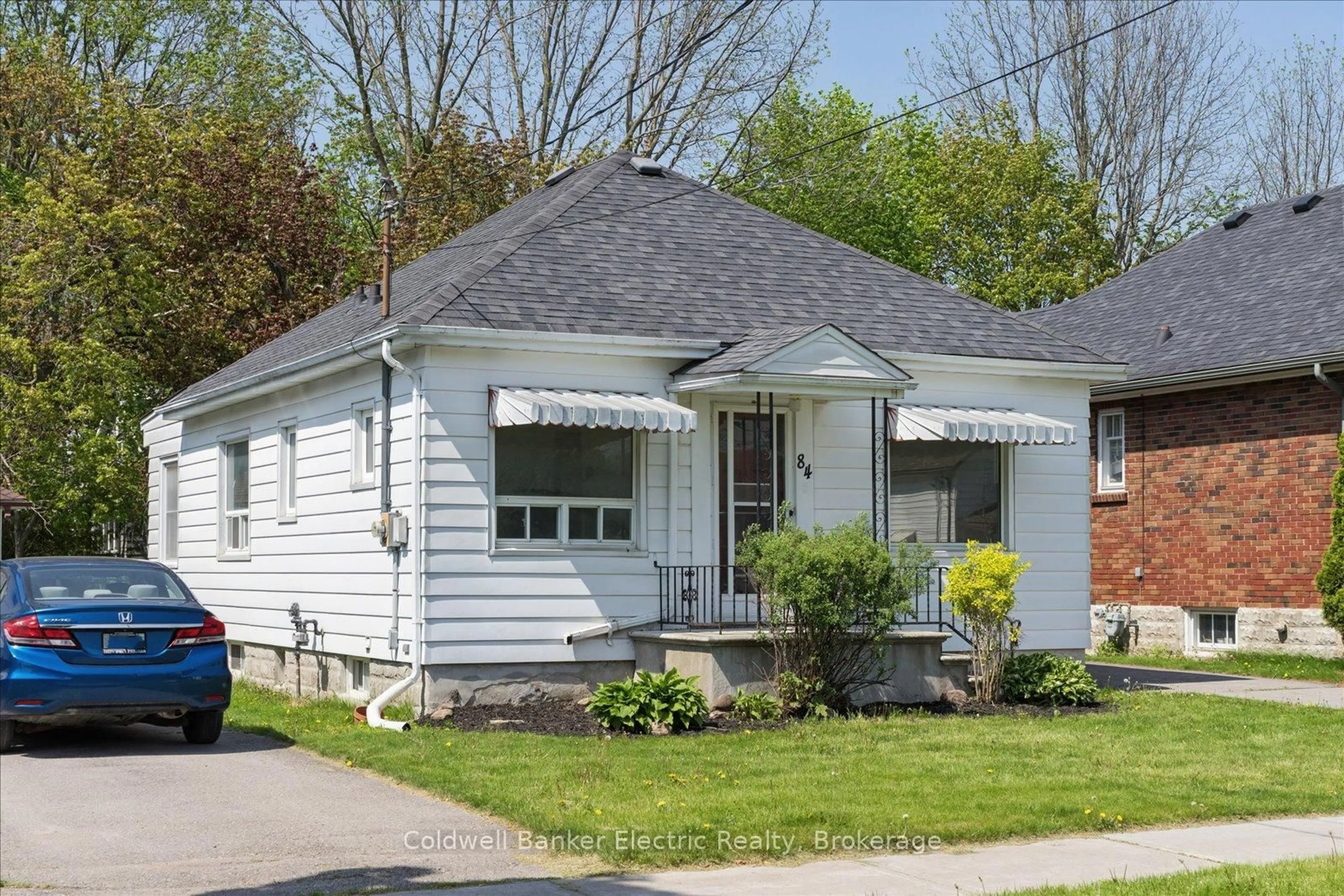 Home with vinyl exterior material, street for 84 Ware St, Peterborough Ontario K9J 2B7