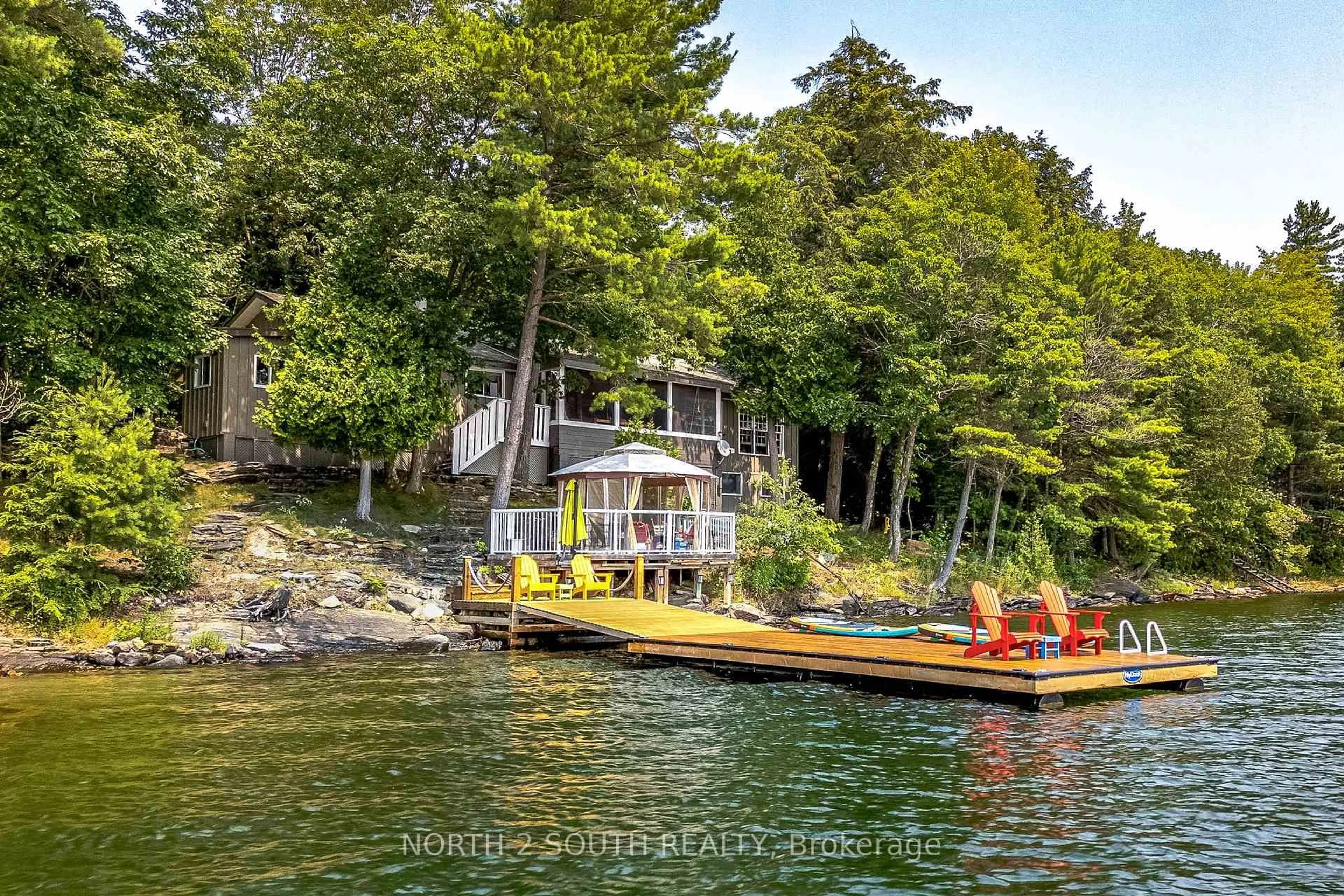 A pic from outside/outdoor area/front of a property/back of a property/a pic from drone, water/lake/river/ocean view for 2133 Harrison Tr, Georgian Bay Ontario P0C 1H0