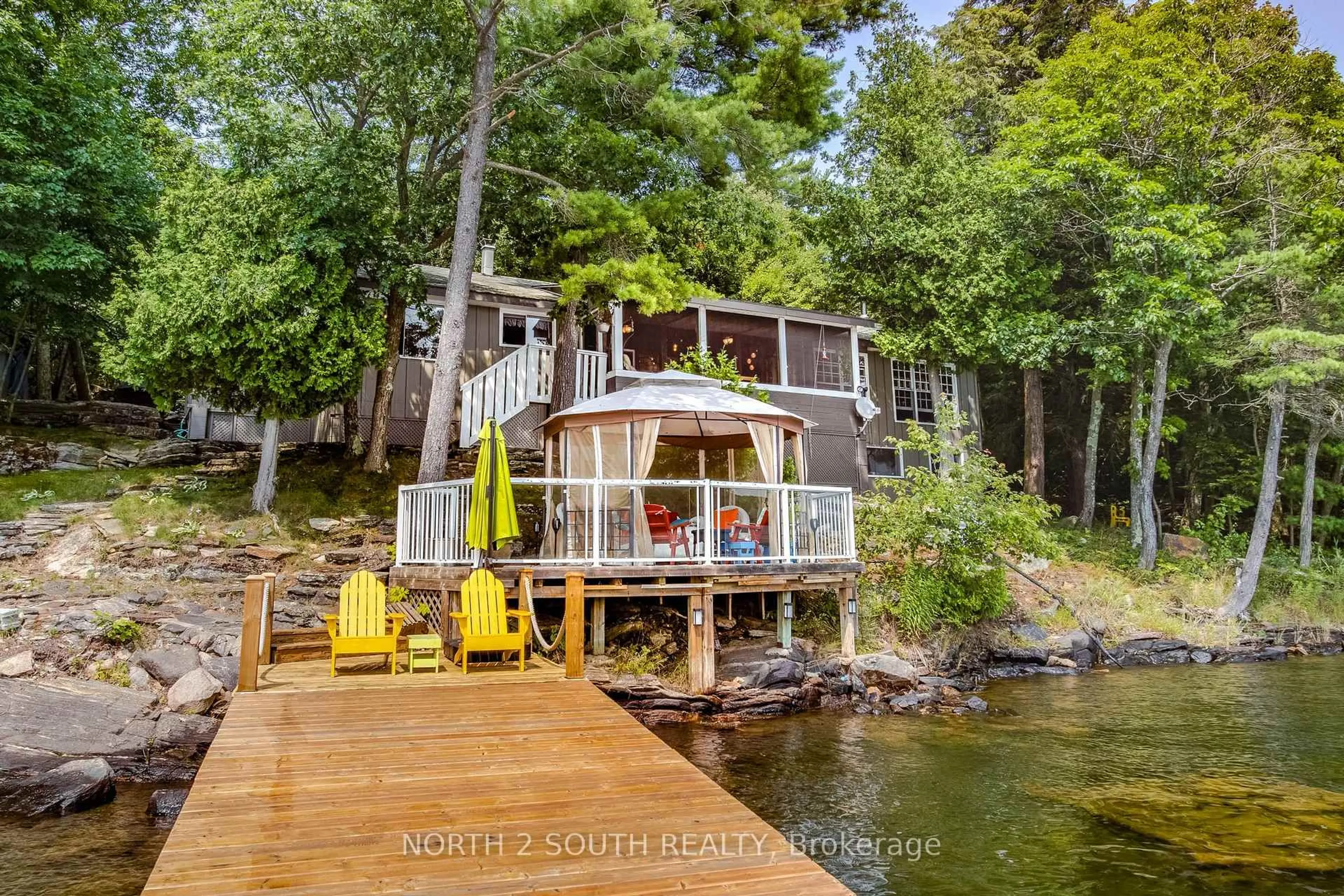 A pic from outside/outdoor area/front of a property/back of a property/a pic from drone, water/lake/river/ocean view for 2133 Harrison Tr, Georgian Bay Ontario P0C 1H0