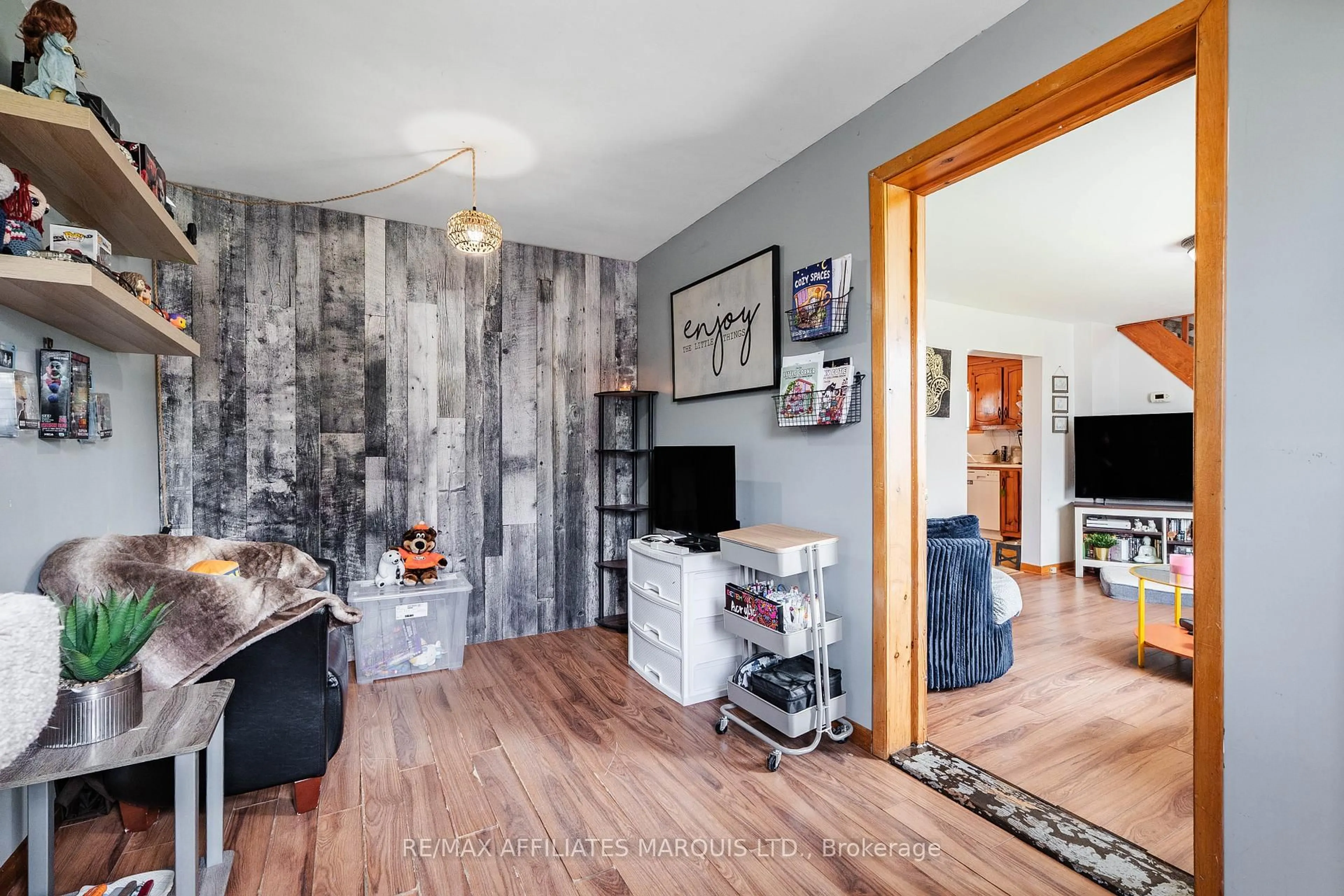 Living room with furniture, wood/laminate floor for 22 Frost Ave, South Stormont Ontario K0C 1P0
