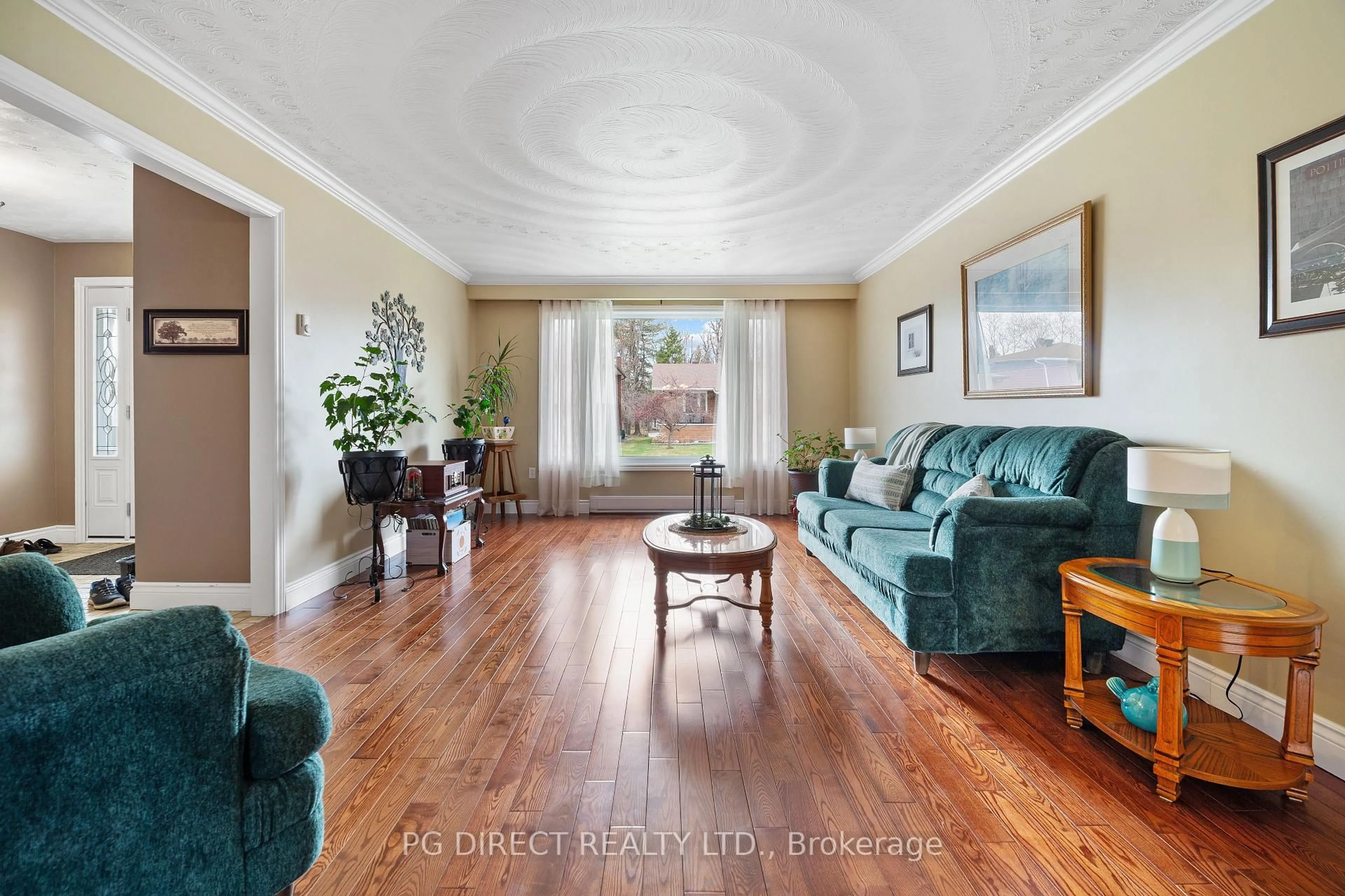 Living room with furniture, wood/laminate floor for 42 Eglee Ave, North Bay Ontario P1B 8Z7