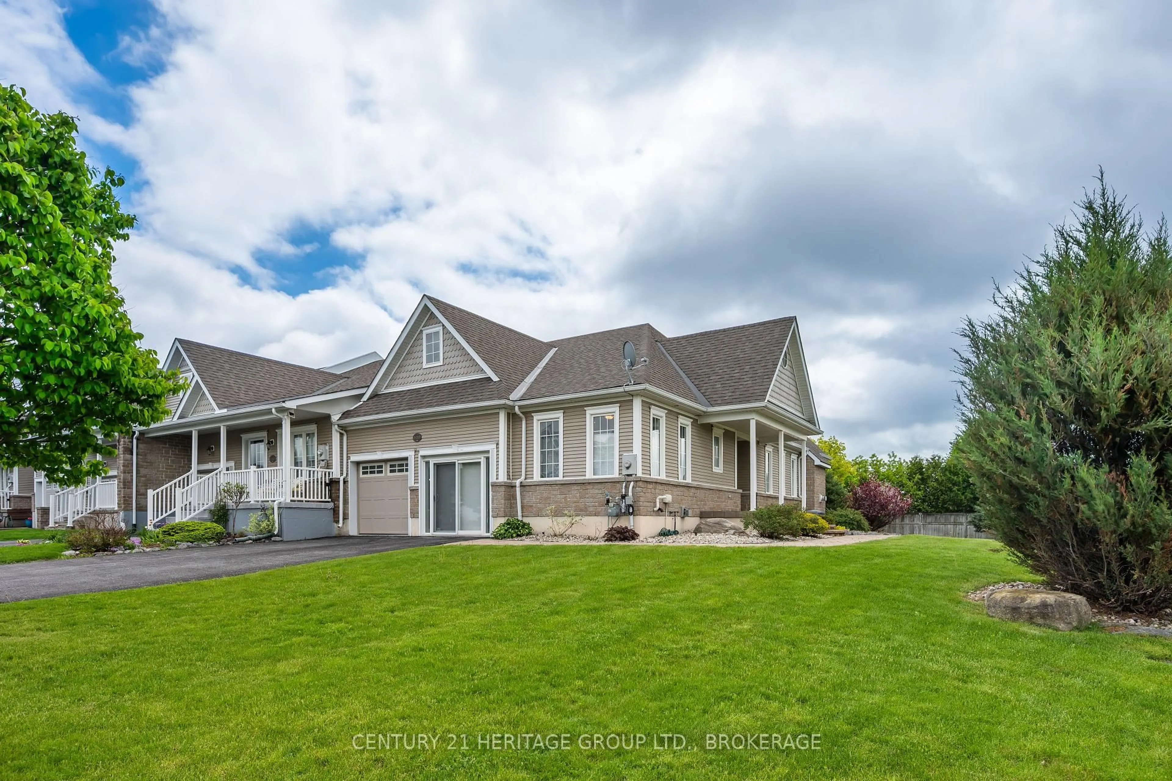 A pic from outside/outdoor area/front of a property/back of a property/a pic from drone, mountain view for 100 BRITANNIA Cres, Bath Ontario K0H 1G0